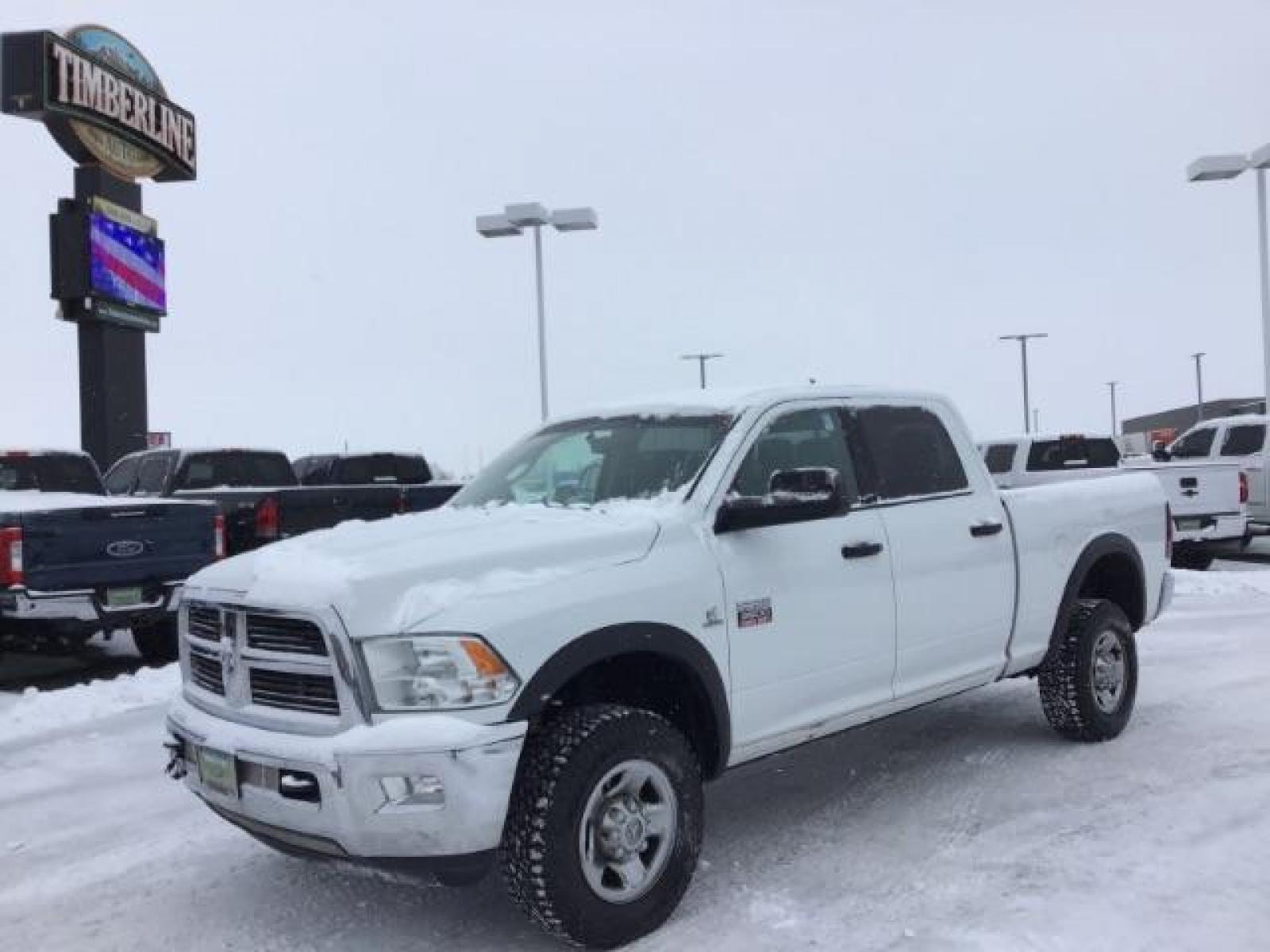 2012 Bright White /Dark Slate/Medium Graystone Cloth Interior RAM 3500 SLT Crew Cab SWB 4WD (3C63D3DLXCG) with an 6.7L L6 OHV 24V TURBO DIESEL engine, 6-Speed Automatic transmission, located at 1235 N Woodruff Ave., Idaho Falls, 83401, (208) 523-1053, 43.507172, -112.000488 - This 2012 Ram 3500 4x4 SLT, has the 6.7L diesel motor. It has 153,000 miles. Comes with cloth seats, AM/FM blue tooth stereo, power locks and windows. At Timberline Auto it is always easy to find a great deal on your next vehicle! Our experienced sales staff can help find the right vehicle that will - Photo #0