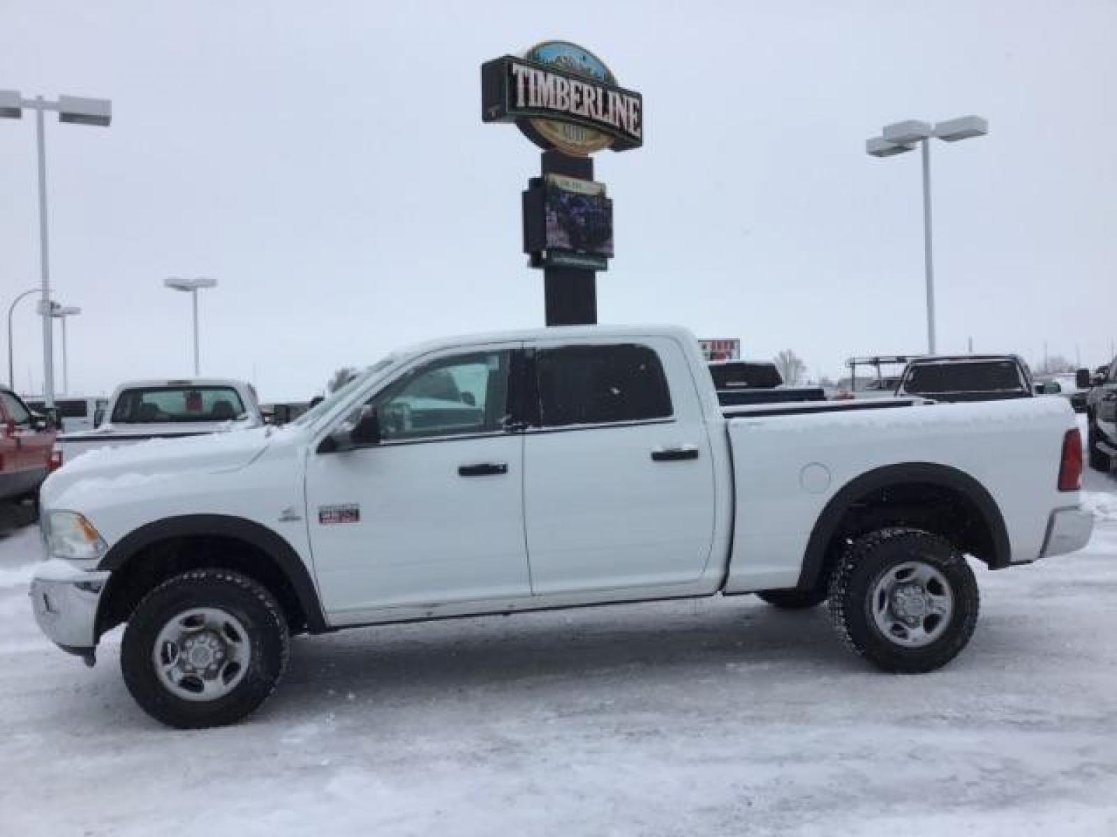 2012 Bright White /Dark Slate/Medium Graystone Cloth Interior RAM 3500 SLT Crew Cab SWB 4WD (3C63D3DLXCG) with an 6.7L L6 OHV 24V TURBO DIESEL engine, 6-Speed Automatic transmission, located at 1235 N Woodruff Ave., Idaho Falls, 83401, (208) 523-1053, 43.507172, -112.000488 - This 2012 Ram 3500 4x4 SLT, has the 6.7L diesel motor. It has 153,000 miles. Comes with cloth seats, AM/FM blue tooth stereo, power locks and windows. At Timberline Auto it is always easy to find a great deal on your next vehicle! Our experienced sales staff can help find the right vehicle that will - Photo #1