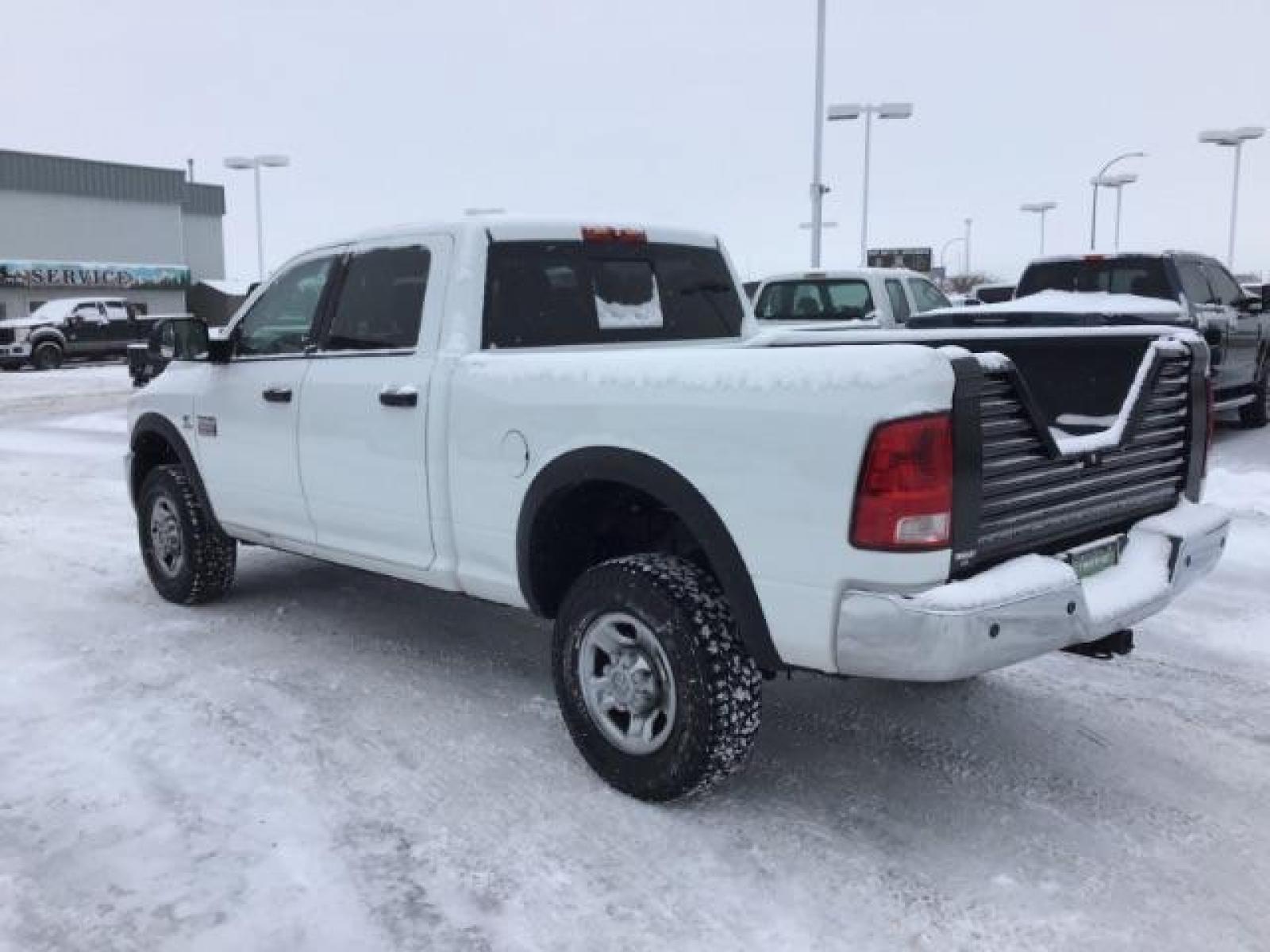 2012 Bright White /Dark Slate/Medium Graystone Cloth Interior RAM 3500 SLT Crew Cab SWB 4WD (3C63D3DLXCG) with an 6.7L L6 OHV 24V TURBO DIESEL engine, 6-Speed Automatic transmission, located at 1235 N Woodruff Ave., Idaho Falls, 83401, (208) 523-1053, 43.507172, -112.000488 - This 2012 Ram 3500 4x4 SLT, has the 6.7L diesel motor. It has 153,000 miles. Comes with cloth seats, AM/FM blue tooth stereo, power locks and windows. At Timberline Auto it is always easy to find a great deal on your next vehicle! Our experienced sales staff can help find the right vehicle that will - Photo #2