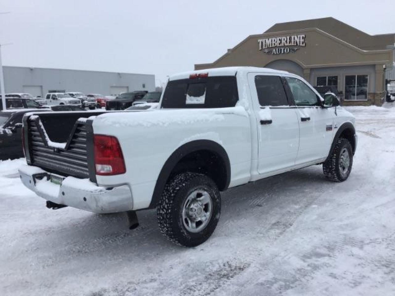 2012 Bright White /Dark Slate/Medium Graystone Cloth Interior RAM 3500 SLT Crew Cab SWB 4WD (3C63D3DLXCG) with an 6.7L L6 OHV 24V TURBO DIESEL engine, 6-Speed Automatic transmission, located at 1235 N Woodruff Ave., Idaho Falls, 83401, (208) 523-1053, 43.507172, -112.000488 - This 2012 Ram 3500 4x4 SLT, has the 6.7L diesel motor. It has 153,000 miles. Comes with cloth seats, AM/FM blue tooth stereo, power locks and windows. At Timberline Auto it is always easy to find a great deal on your next vehicle! Our experienced sales staff can help find the right vehicle that will - Photo #4