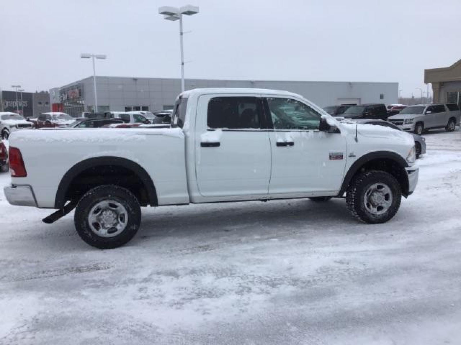 2012 Bright White /Dark Slate/Medium Graystone Cloth Interior RAM 3500 SLT Crew Cab SWB 4WD (3C63D3DLXCG) with an 6.7L L6 OHV 24V TURBO DIESEL engine, 6-Speed Automatic transmission, located at 1235 N Woodruff Ave., Idaho Falls, 83401, (208) 523-1053, 43.507172, -112.000488 - This 2012 Ram 3500 4x4 SLT, has the 6.7L diesel motor. It has 153,000 miles. Comes with cloth seats, AM/FM blue tooth stereo, power locks and windows. At Timberline Auto it is always easy to find a great deal on your next vehicle! Our experienced sales staff can help find the right vehicle that will - Photo #5