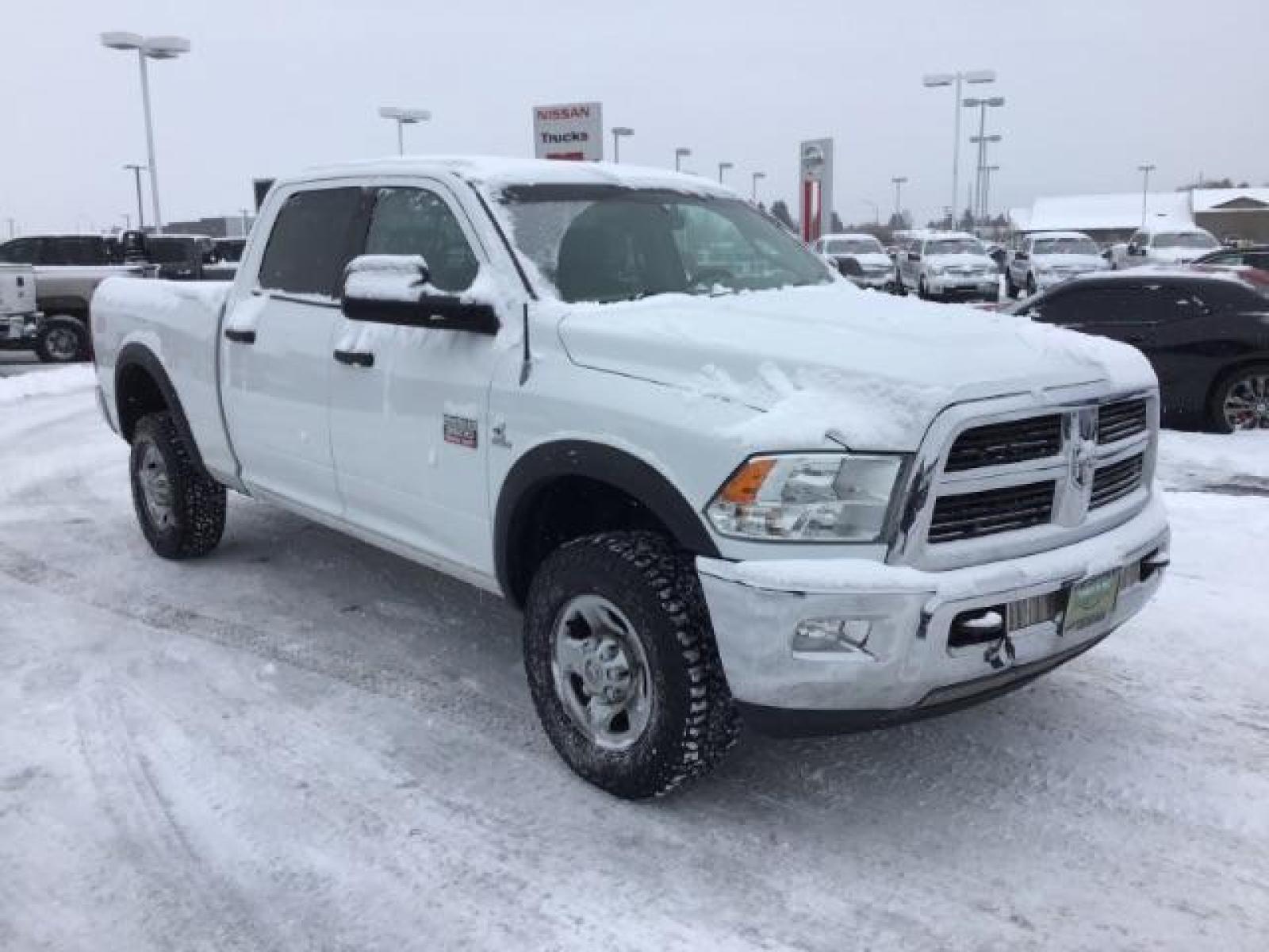 2012 Bright White /Dark Slate/Medium Graystone Cloth Interior RAM 3500 SLT Crew Cab SWB 4WD (3C63D3DLXCG) with an 6.7L L6 OHV 24V TURBO DIESEL engine, 6-Speed Automatic transmission, located at 1235 N Woodruff Ave., Idaho Falls, 83401, (208) 523-1053, 43.507172, -112.000488 - This 2012 Ram 3500 4x4 SLT, has the 6.7L diesel motor. It has 153,000 miles. Comes with cloth seats, AM/FM blue tooth stereo, power locks and windows. At Timberline Auto it is always easy to find a great deal on your next vehicle! Our experienced sales staff can help find the right vehicle that will - Photo #6