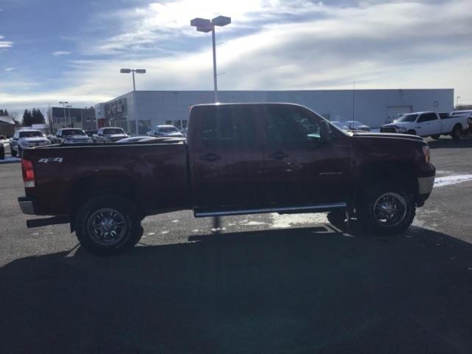2013 Sonoma Red Metallic /Dark Titanium/Light Titanium Leather Interior GMC Sierra 2500HD SLT Crew Cab 4WD (1GT121C81DF) with an 6.6L V8 OHV 32V TURBO DIESEL engine, 6-Speed Automatic transmission, located at 1235 N Woodruff Ave., Idaho Falls, 83401, (208) 523-1053, 43.507172, -112.000488 - This 2013 GMC Sierra SLT 4x4, has the 6.6L duramax motor. It has 124,000 miles. Comes with leather interior, heated seats, blue tooth, dual power seats, key less remote, and turn over ball. At Timberline Auto it is always easy to find a great deal on your next vehicle! Our experienced sales staff ca - Photo #5