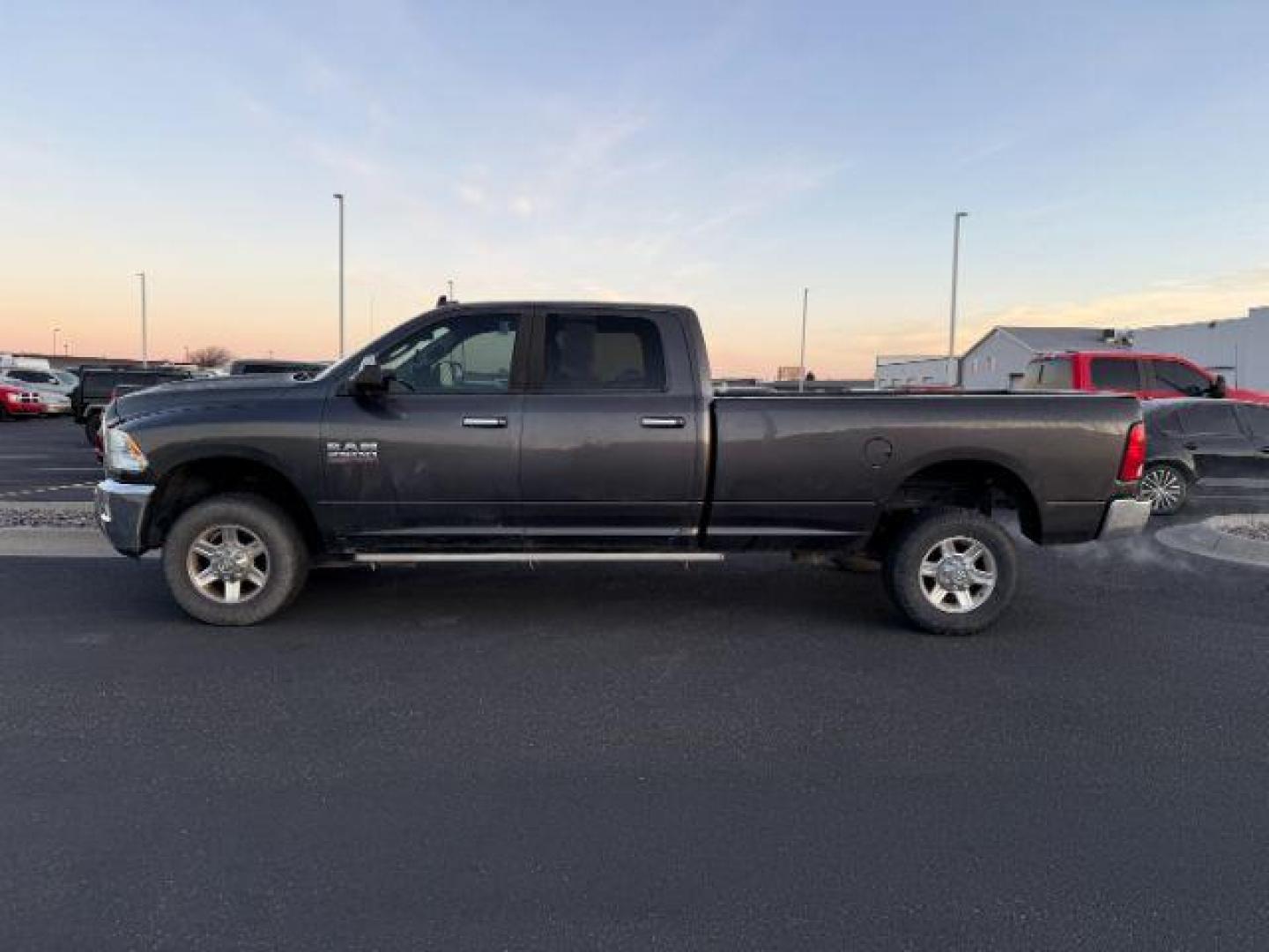 2014 GRAY /Diesel Gray/Black Ram 2500 (3C6TR5JT8EG) with an 57L V8 OHV 16V engine, Automatic transmission, located at 1175 N Woodruff Ave, Idaho Falls, ID, 83401, 43.506901, -111.999657 - At Timberline Auto, finding a great deal on your next vehicle is always easy! Our experienced sales staff's goal is to help find you the right vehicle at the right price! Our knowledgeable finance department has options for almost any credit score. We offer extended service contract options to prote - Photo#1