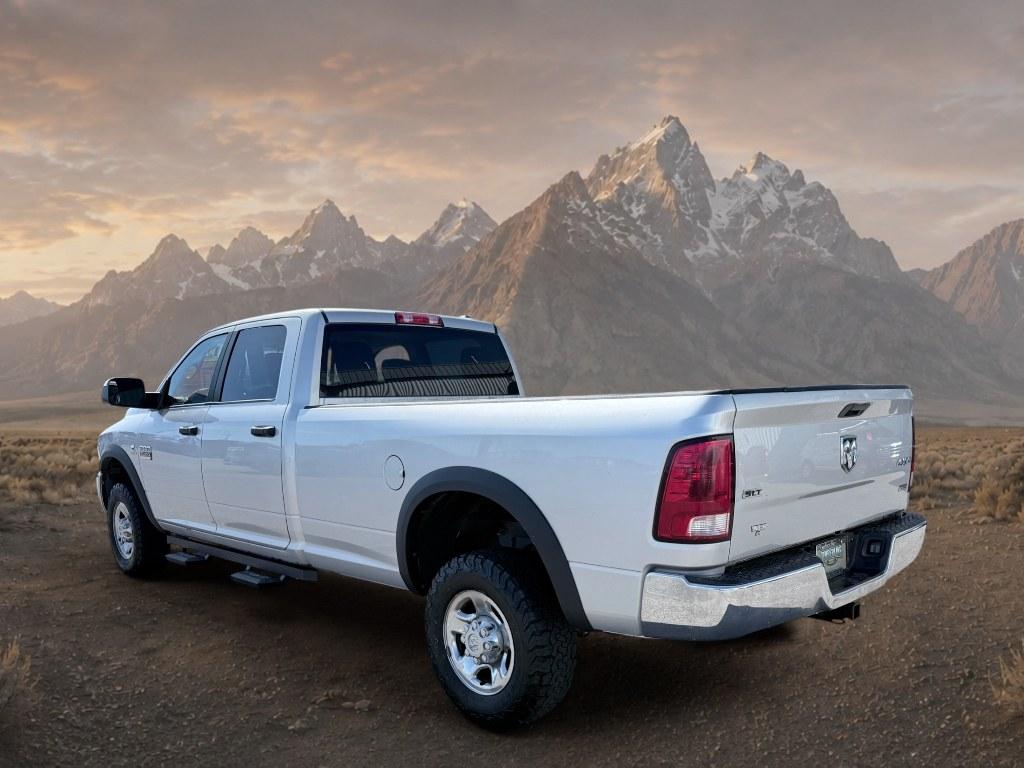 2012 Bright Silver Metallic Clearcoat /CLOTH Ram 3500 SLT (3C63D3HL0CG) with an 6 Cyl, 6.7L engine, 6-speed manual transmission, located at 1175 N Woodruff Ave, Idaho Falls, ID, 83401, 43.506901, -111.999657 - <b>Vehicle Details</b><br>Take on heavy-duty jobs with confidence in this **pre-owned 2012 Ram 3500 SLT 4WD** now available in **Idaho Falls, ID**. Built for drivers who need serious capability, this rugged Ram pairs a powerful **6.7L 6-cylinder Diesel engine** with proven **four-wheel drive** perfo- Photo#2