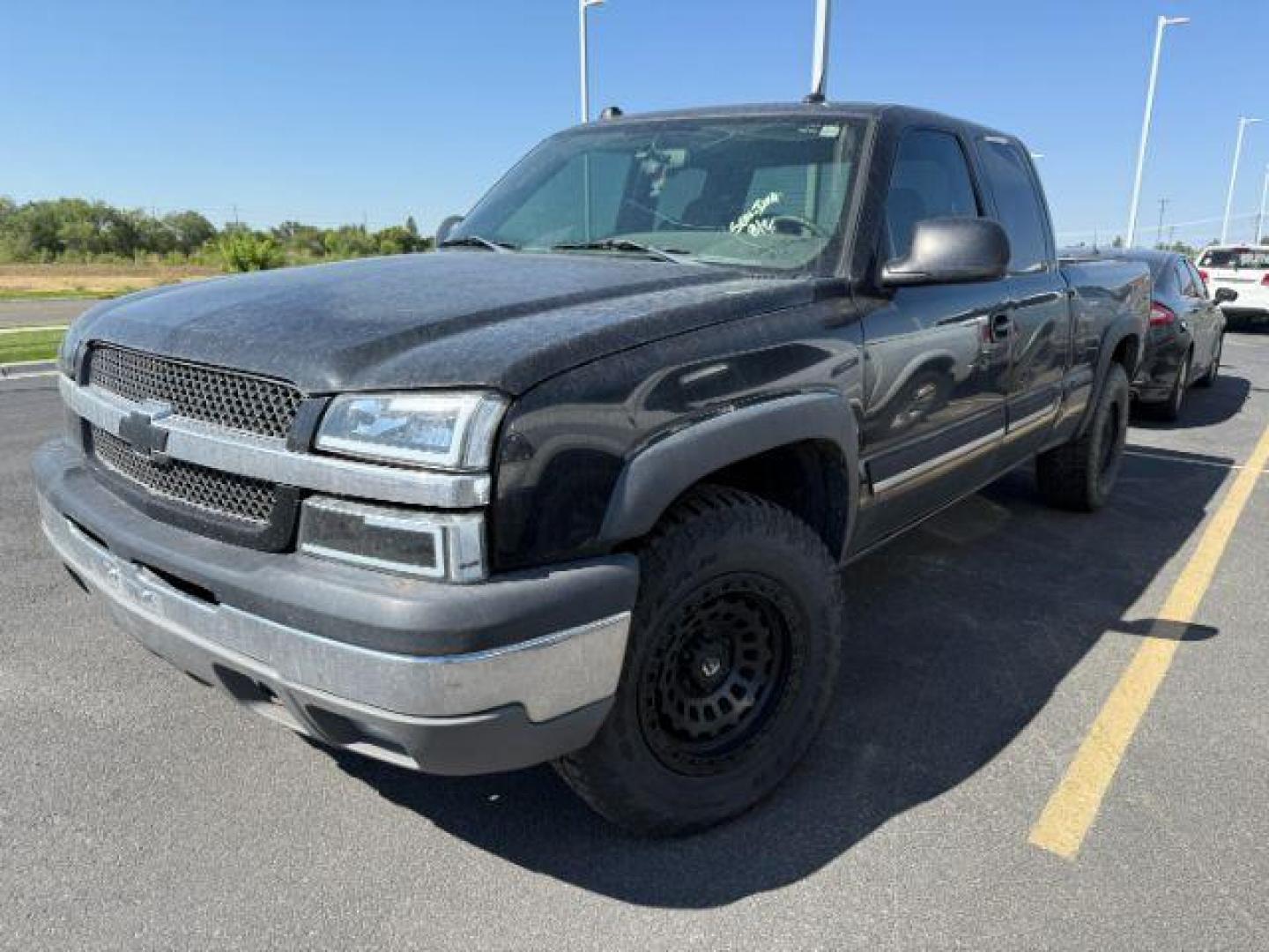 2004 BLACK /Dark Charcoal Cloth Interior Chevrolet Silverado 1500 (1GCEK19T54E) with an 53L V8 OHV 16V engine, Automatic transmission, located at 1175 N Woodruff Ave, Idaho Falls, ID, 83401, 43.506901, -111.999657 - At Timberline Auto, finding a great deal on your next vehicle is always easy! Our experienced sales staff's goal is to help find you the right vehicle at the right price! Our knowledgeable finance department has options for almost any credit score. We offer extended service contract options to prote - Photo#1