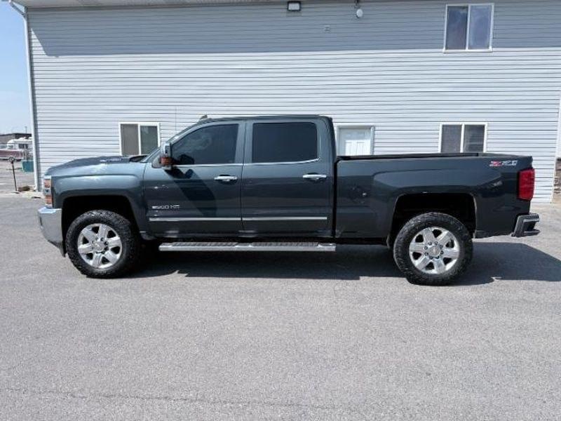 2017 GRAY /Jet Black Chevrolet Silverado LTZ (1GC1KWEY9HF) with an V8, 6.6L engine, 6-speed automatic transmission, located at 1175 N Woodruff Ave, Idaho Falls, ID, 83401, 43.506901, -111.999657 - <b>Vehicle Details</b><br>Take on tough jobs and weekend adventures with confidence in this 2017 Chevrolet Silverado 2500 LTZ 4WD, now available in Idaho Falls, ID. Powered by a proven V8 6.6L Diesel engine, this heavy-duty pickup delivers impressive towing strength, refined comfort, and the dependa- Photo#1