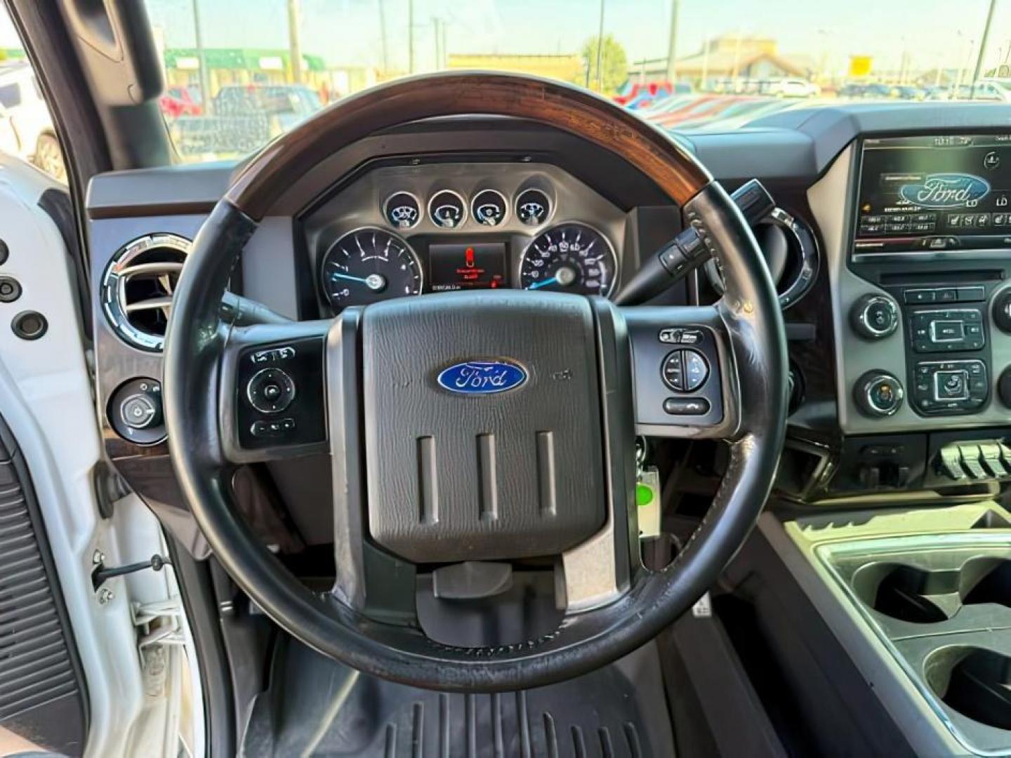 2014 WHITE /BROWN LEATHER FORD F350 PLATINUM (1FT8W3BT4EE) with an 6.7L engine, AUTOMATIC transmission, located at 1235 N Woodruff Ave., Idaho Falls, 83401, (208) 523-1053, 43.507172, -112.000488 - At Timberline Auto, finding a great deal on your next vehicle is always easy! Our experienced sales staff's goal is to help find you the right vehicle at the right price! Our knowledgeable finance department has options for almost any credit score. We offer extended service contract options to prote - Photo#11