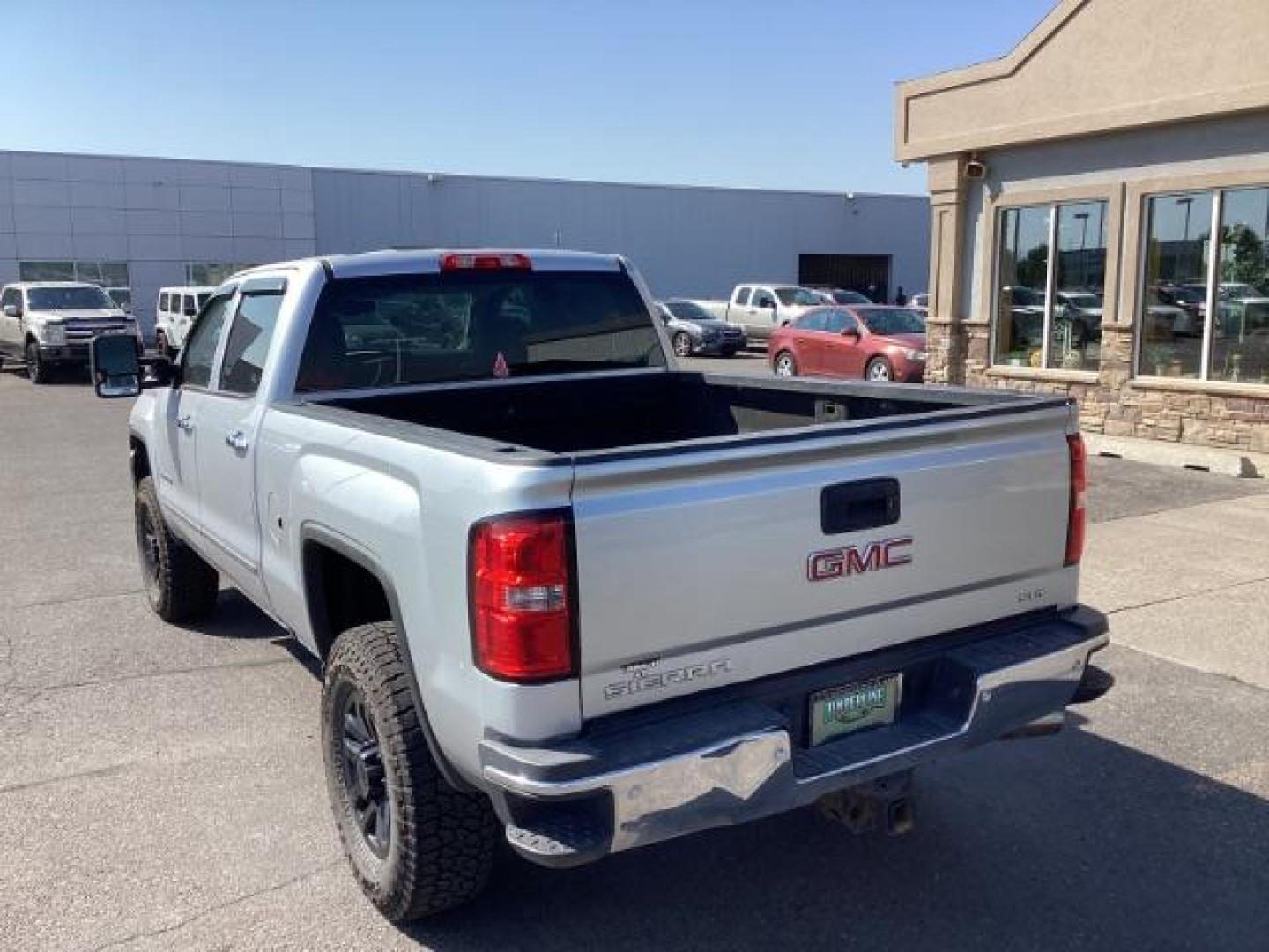 2015 Quicksilver Metallic /Jet Black GMC Sierra 2500HD SLT Crew Cab 4WD (1GT12ZE88FF) with an 6.6L V8 OHV 16V DIESEL engine, 6-Speed Automatic transmission, located at 1235 N Woodruff Ave., Idaho Falls, 83401, (208) 523-1053, 43.507172, -112.000488 - Photo#3