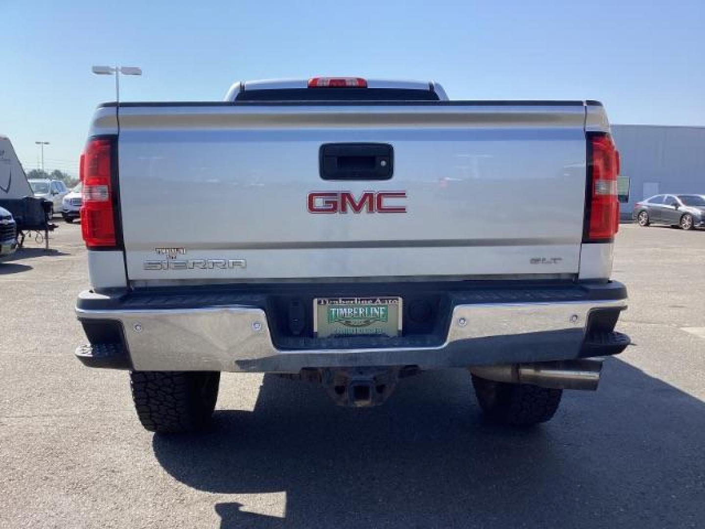 2015 Quicksilver Metallic /Jet Black GMC Sierra 2500HD SLT Crew Cab 4WD (1GT12ZE88FF) with an 6.6L V8 OHV 16V DIESEL engine, 6-Speed Automatic transmission, located at 1235 N Woodruff Ave., Idaho Falls, 83401, (208) 523-1053, 43.507172, -112.000488 - Photo#4