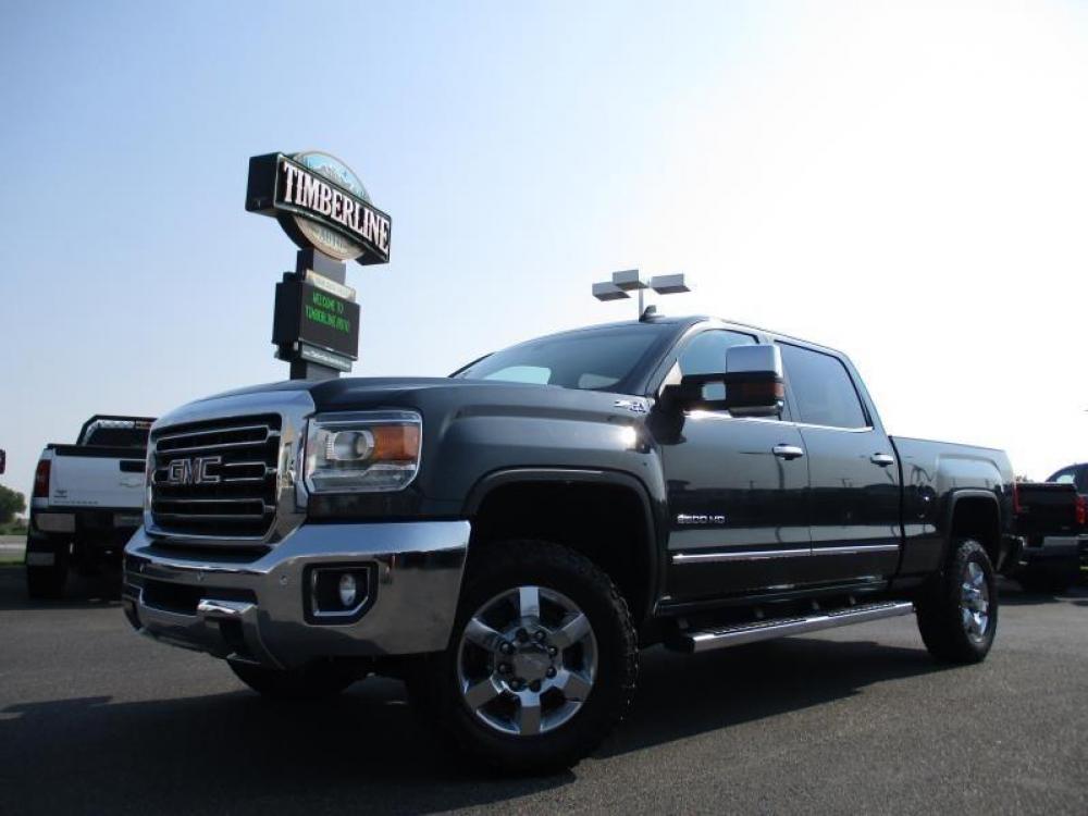 2017 GRAY /BLACK GMC SIERRA 2500 SLT (1GT12TEG6HF) with an 8 engine, Automatic transmission, located at 1580 E Lincoln Rd, Idaho Falls, ID, 83401, (208) 523-4000, 0.000000, 0.000000 - 6.0L VORTEC- 4WD- SHORT BED- DRIVEN 103,081 MILES- LEATHER INTERIOR. 2017 GMC 2500 SLT Z71. Great body, clean paint, spotless interior, and good miles. Equipped with fixed running boards, tow mirrors, bed liner, and tonneua cover. Sit back and enjoy this trucks heated seats and heated steering w - Photo #1