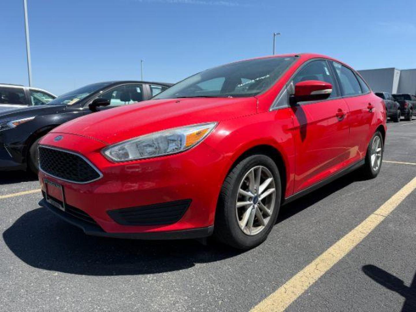 2017 Ruby Red Metallic Tinted Clearcoat /Charcoal Black Ford Focus SE (1FADP3F26HL) with an 2L I-4 gasoline direct injection engine, AUTOMATIC transmission, located at 1235 N Woodruff Ave., Idaho Falls, 83401, (208) 523-1053, 43.507172, -112.000488 - At Timberline Auto, finding a great deal on your next vehicle is always easy! Our experienced sales staff's goal is to help find you the right vehicle at the right price! Our knowledgeable finance department has options for almost any credit score. We offer extended service contract options to prote - Photo#0