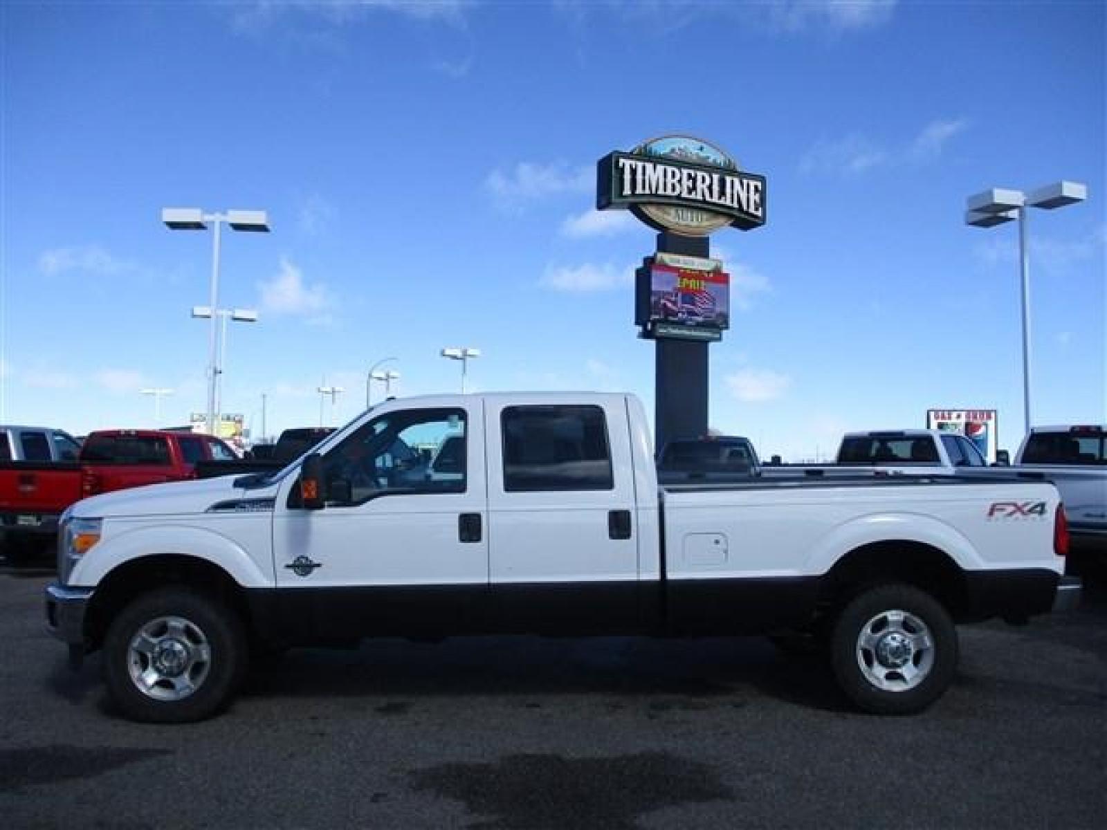 2015 WHITE /GREY FORD F350 XLT (1FT8W3BT9FE) with an 8 engine, Automatic transmission, located at 1580 E Lincoln Rd, Idaho Falls, ID, 83401, (208) 523-4000, 0.000000, 0.000000 - FX4 PACKAGE. RHINO LINED ROCKERS. NEVER HAD A FIFTH WHEEL INSTALLED. NEWER TIRES WITH 80% TREAD LEFT. 8 FOOT BED. TOW MIRRORS. VYNIL FLOORING. 4 WHEEL DRIVE WITH LOCKING REAR DIFF. TRAILER BRAKE. EXHAUST BRAKE. AUXILIARY SWITCHES. CRUSISE CONTROL. POWER WINDOWS/LOCKS. 6.7L POWERSTROKE- 4WD- CREW - Photo #2