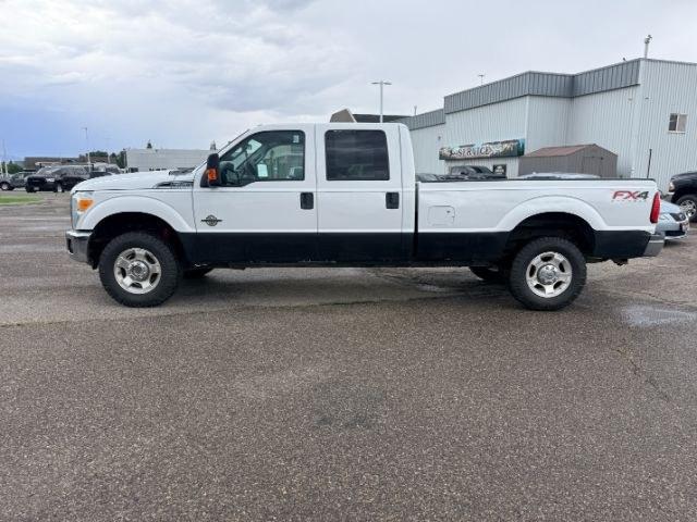 2015 WHITE /Steel Ford F-350 SD XL Crew Cab Long Bed 4WD (1FT8W3BT9FE) with an 6.7L V8 OHV 16V DIESEL engine, 6-Speed Automatic transmission, located at 1235 N Woodruff Ave., Idaho Falls, 83401, (208) 523-1053, 43.507172, -112.000488 - Serious towing and heavy duty truck performance come together in this 2015 Ford F-350 Super Duty Crew Cab 4x4 equipped with a 6.7L Power Stroke turbo diesel engine. Diesel torque and Super Duty engineering provide the strength truck buyers look for when handling trailers, equipment, and larger hauli- Photo#27