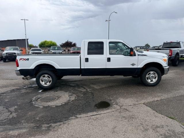 2015 WHITE /Steel Ford F-350 SD XL Crew Cab Long Bed 4WD (1FT8W3BT9FE) with an 6.7L V8 OHV 16V DIESEL engine, 6-Speed Automatic transmission, located at 1235 N Woodruff Ave., Idaho Falls, 83401, (208) 523-1053, 43.507172, -112.000488 - Serious towing and heavy duty truck performance come together in this 2015 Ford F-350 Super Duty Crew Cab 4x4 equipped with a 6.7L Power Stroke turbo diesel engine. Diesel torque and Super Duty engineering provide the strength truck buyers look for when handling trailers, equipment, and larger hauli- Photo#32