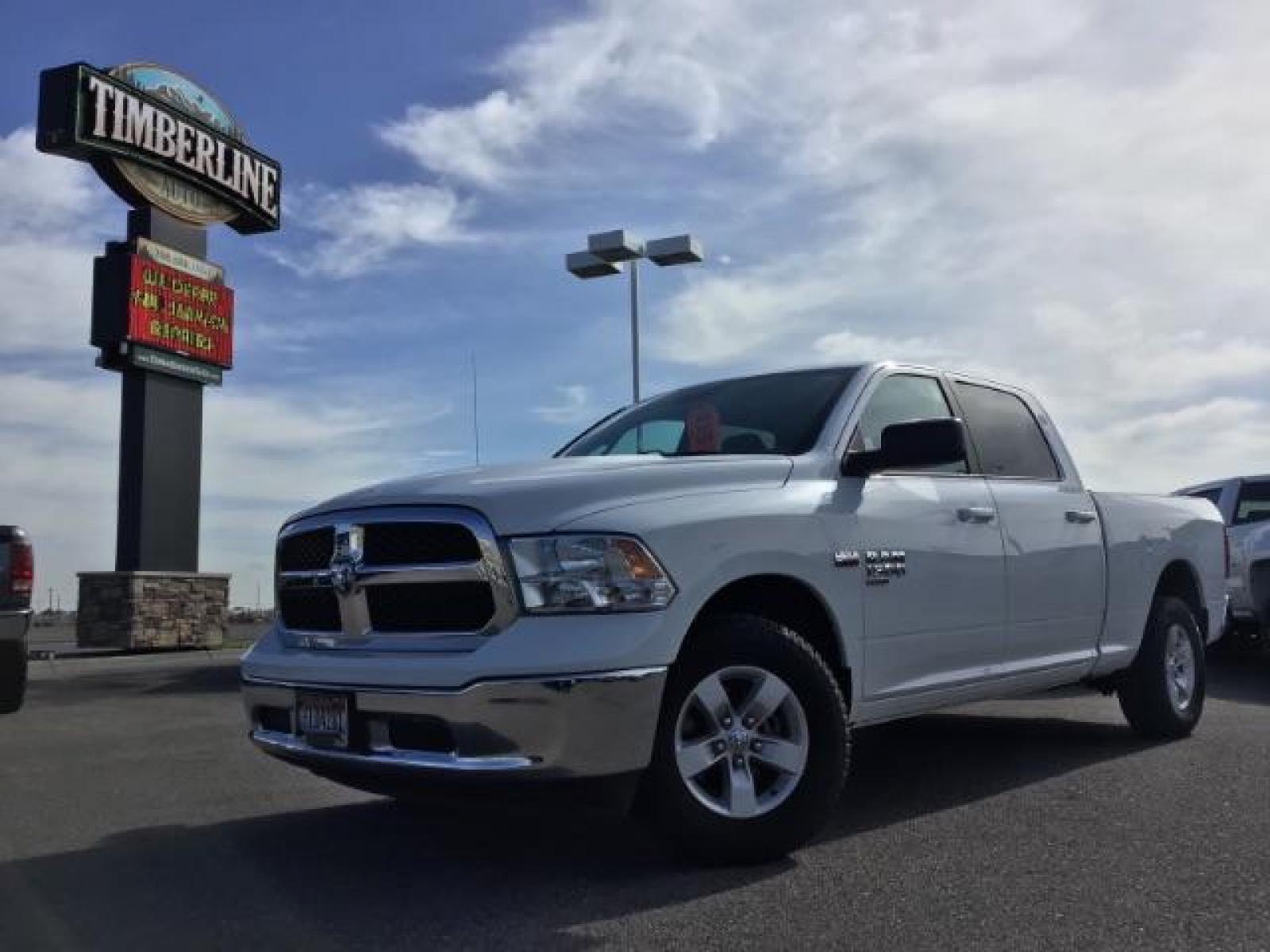 2019 Bright White Clear Coat /Black/Diesel Gray, cloth RAM 1500 Classic Tradesman Crew Cab LWB 4WD (1C6RR7TT0KS) with an 5.7L V8 OHV 16V engine, 8-Speed Automatic transmission, located at 1235 N Woodruff Ave., Idaho Falls, 83401, (208) 523-1053, 43.507172, -112.000488 - Here's a vehicle that has all of the modern mechanical features without all the fancy bells and whistles on the inside. The Classic trim package offers manual adjustable seating, a smaller info-tainment screen, but still has power windows and locks. The 5.7L V8 HEMI engine offers up to 7,500 max tow - Photo #0