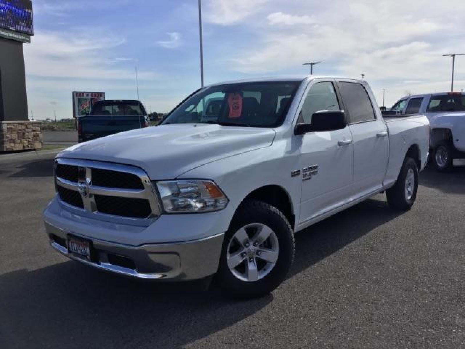 2019 Bright White Clear Coat /Black/Diesel Gray, cloth RAM 1500 Classic Tradesman Crew Cab LWB 4WD (1C6RR7TT0KS) with an 5.7L V8 OHV 16V engine, 8-Speed Automatic transmission, located at 1235 N Woodruff Ave., Idaho Falls, 83401, (208) 523-1053, 43.507172, -112.000488 - Here's a vehicle that has all of the modern mechanical features without all the fancy bells and whistles on the inside. The Classic trim package offers manual adjustable seating, a smaller info-tainment screen, but still has power windows and locks. The 5.7L V8 HEMI engine offers up to 7,500 max tow - Photo #1