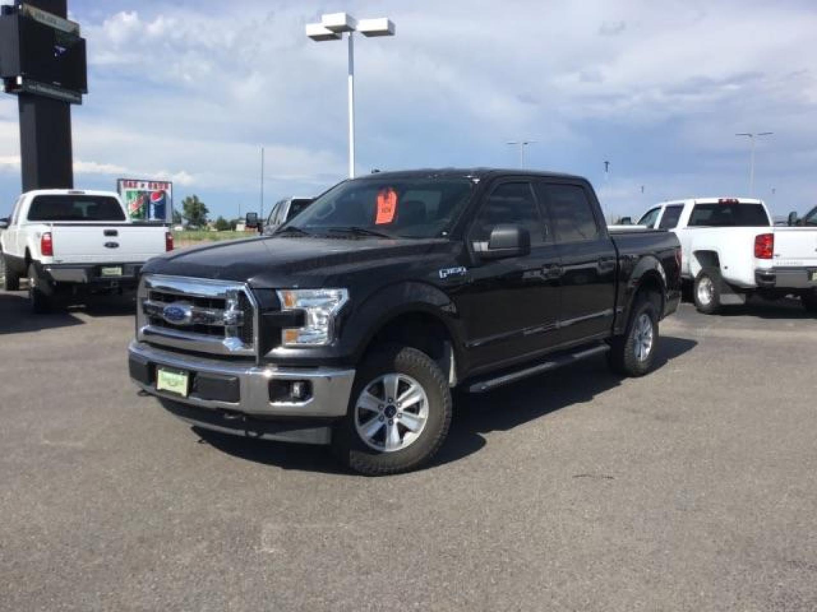 2017 Shadow Black /Medium Earth Gray, cloth Ford F-150 XLT SuperCrew 5.5-ft. Bed 4WD (1FTEW1EGXHF) with an 3.5L V6 TURBO engine, 6-Speed Automatic transmission, located at 1235 N Woodruff Ave., Idaho Falls, 83401, (208) 523-1053, 43.507172, -112.000488 - MotorTrend states this pickup has the abilities to achieve 18-25 MPG!! Body and paint are in amazing condition! Interior has no tears and nothing missing. Has the factory Ford running boards. Comes with a soft top tonneua cover, spray-in bedliner, and full sized rubber floor mats to protect the carp - Photo #1