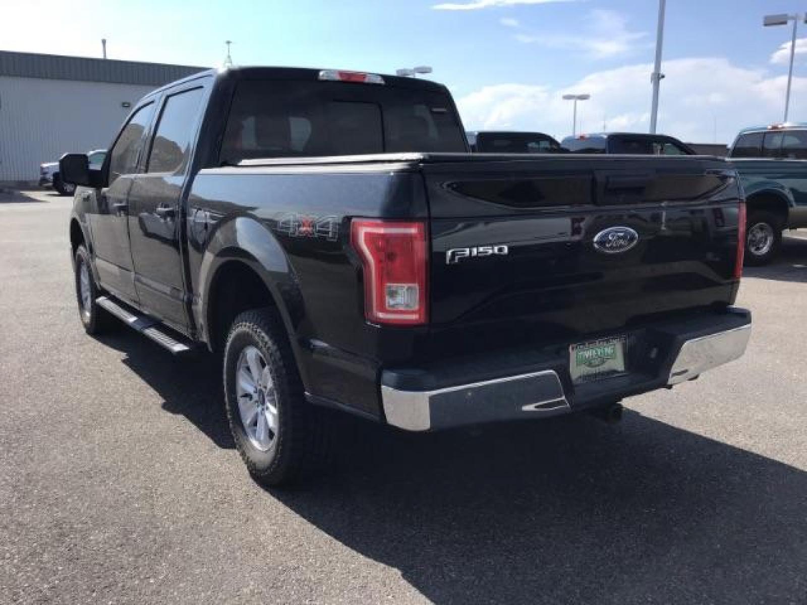 2017 Shadow Black /Medium Earth Gray, cloth Ford F-150 XLT SuperCrew 5.5-ft. Bed 4WD (1FTEW1EGXHF) with an 3.5L V6 TURBO engine, 6-Speed Automatic transmission, located at 1235 N Woodruff Ave., Idaho Falls, 83401, (208) 523-1053, 43.507172, -112.000488 - MotorTrend states this pickup has the abilities to achieve 18-25 MPG!! Body and paint are in amazing condition! Interior has no tears and nothing missing. Has the factory Ford running boards. Comes with a soft top tonneua cover, spray-in bedliner, and full sized rubber floor mats to protect the carp - Photo #3
