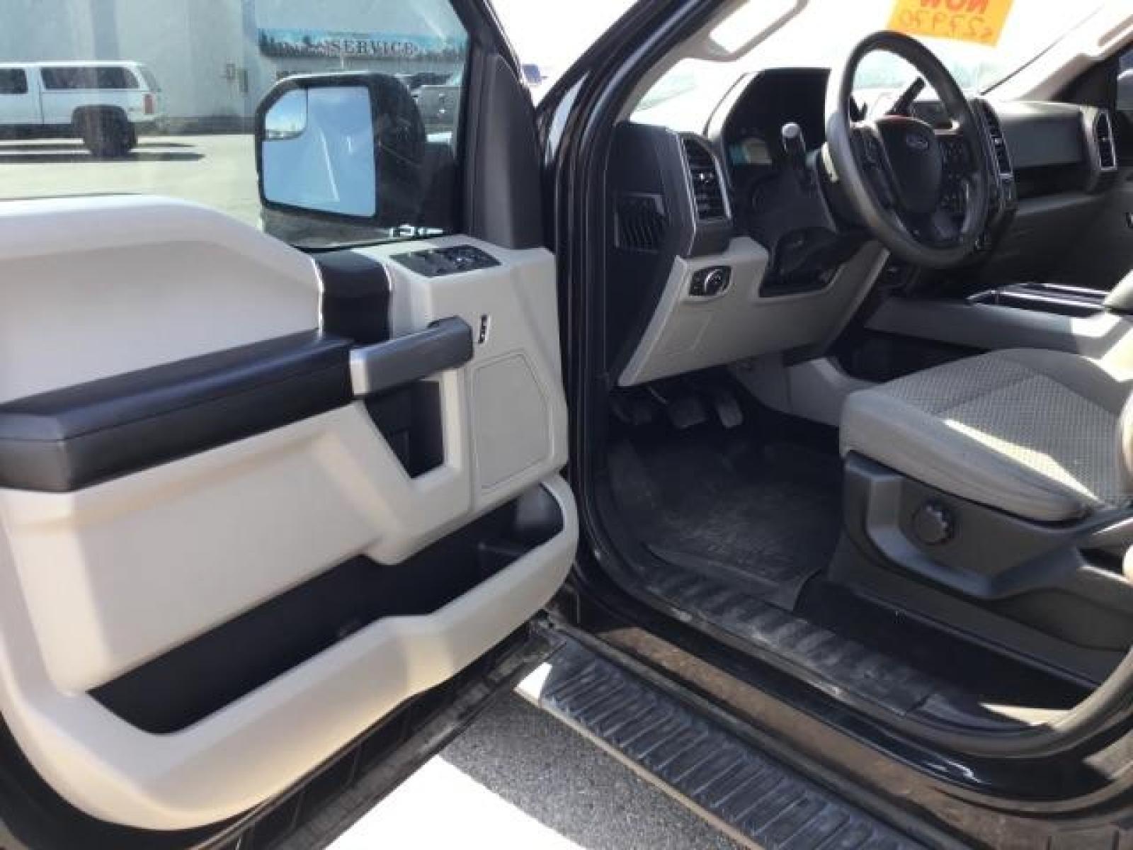 2017 Shadow Black /Medium Earth Gray, cloth Ford F-150 XLT SuperCrew 5.5-ft. Bed 4WD (1FTEW1EGXHF) with an 3.5L V6 TURBO engine, 6-Speed Automatic transmission, located at 1235 N Woodruff Ave., Idaho Falls, 83401, (208) 523-1053, 43.507172, -112.000488 - MotorTrend states this pickup has the abilities to achieve 18-25 MPG!! Body and paint are in amazing condition! Interior has no tears and nothing missing. Has the factory Ford running boards. Comes with a soft top tonneua cover, spray-in bedliner, and full sized rubber floor mats to protect the carp - Photo #9