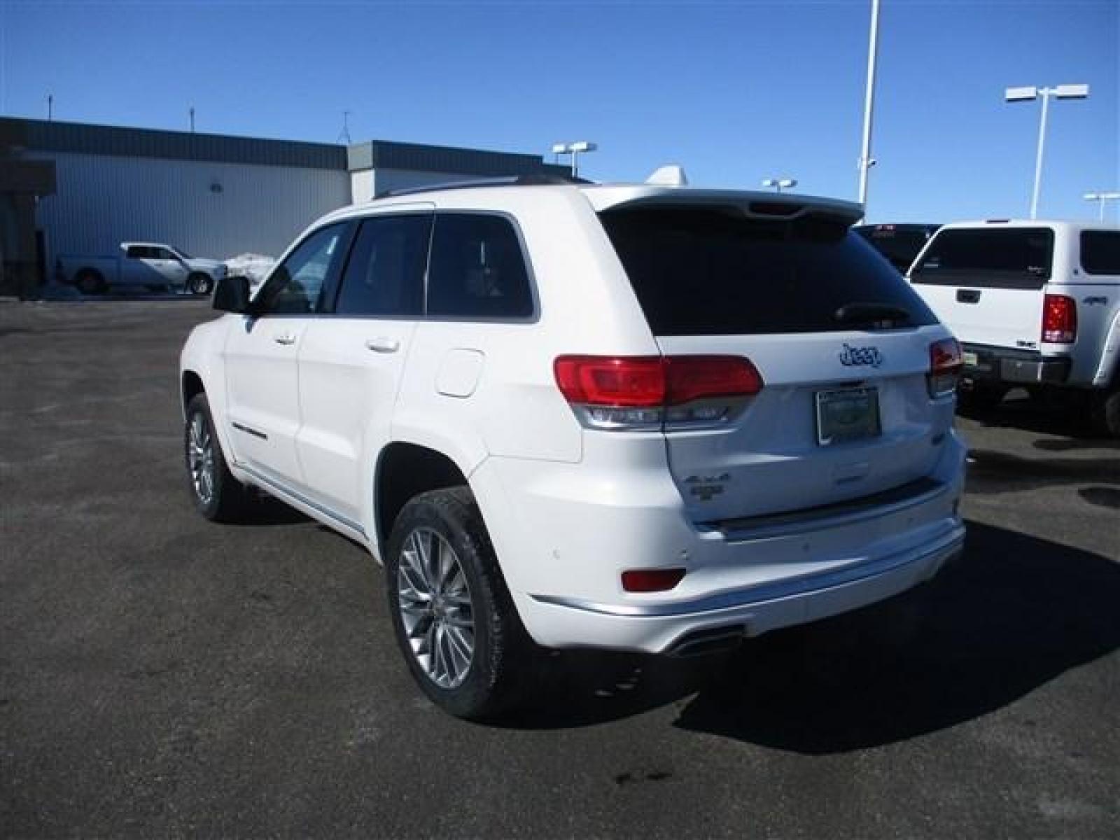 2018 WHITE /BLACK JEEP GRAND CHEROKEE SUMMIT (1C4RJFJTXJC) with an 8 engine, Automatic transmission, located at 1580 E Lincoln Rd, Idaho Falls, ID, 83401, (208) 523-4000, 0.000000, 0.000000 - ADJUSTABLE RIDE HEIGHTH. FACTORY PREMIUM 20 INCH WHEELS. SLEEK COLOR MATCHED BUMPERS. SUMMIT PREMIUM LEATHER INTERIOR IN PERFECT CONDITION. HEATED AND COOLED SEATS. HEATED STEERING WHEEL. HEATED REAR SEATS. PARK ASSIST. LANE ASSIST. ECONOMY MODE. SPORT MODE. BLIND SPOT MINITOR. ADAPTIVE CRUISE CONTR - Photo #3
