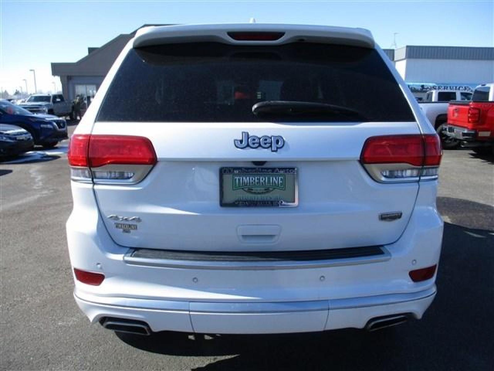 2018 WHITE /BLACK JEEP GRAND CHEROKEE SUMMIT (1C4RJFJTXJC) with an 8 engine, Automatic transmission, located at 1580 E Lincoln Rd, Idaho Falls, ID, 83401, (208) 523-4000, 0.000000, 0.000000 - ADJUSTABLE RIDE HEIGHTH. FACTORY PREMIUM 20 INCH WHEELS. SLEEK COLOR MATCHED BUMPERS. SUMMIT PREMIUM LEATHER INTERIOR IN PERFECT CONDITION. HEATED AND COOLED SEATS. HEATED STEERING WHEEL. HEATED REAR SEATS. PARK ASSIST. LANE ASSIST. ECONOMY MODE. SPORT MODE. BLIND SPOT MINITOR. ADAPTIVE CRUISE CONTR - Photo #4