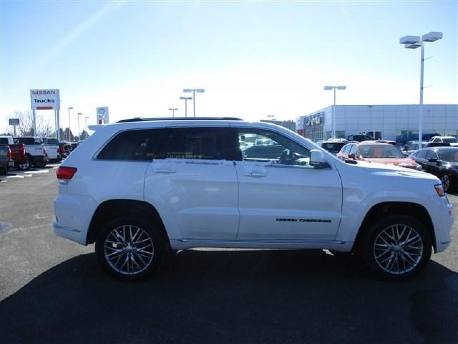 2018 WHITE /BLACK JEEP GRAND CHEROKEE SUMMIT (1C4RJFJTXJC) with an 8 engine, Automatic transmission, located at 1235 N Woodruff Ave., Idaho Falls, 83401, (208) 523-1053, 43.507172, -112.000488 - ADJUSTABLE RIDE HEIGHTH. FACTORY PREMIUM 20 INCH WHEELS. SLEEK COLOR MATCHED BUMPERS. SUMMIT PREMIUM LEATHER INTERIOR IN PERFECT CONDITION. HEATED AND COOLED SEATS. HEATED STEERING WHEEL. HEATED REAR SEATS. PARK ASSIST. LANE ASSIST. ECONOMY MODE. SPORT MODE. BLIND SPOT MINITOR. ADAPTIVE CRUISE CONTR - Photo #6