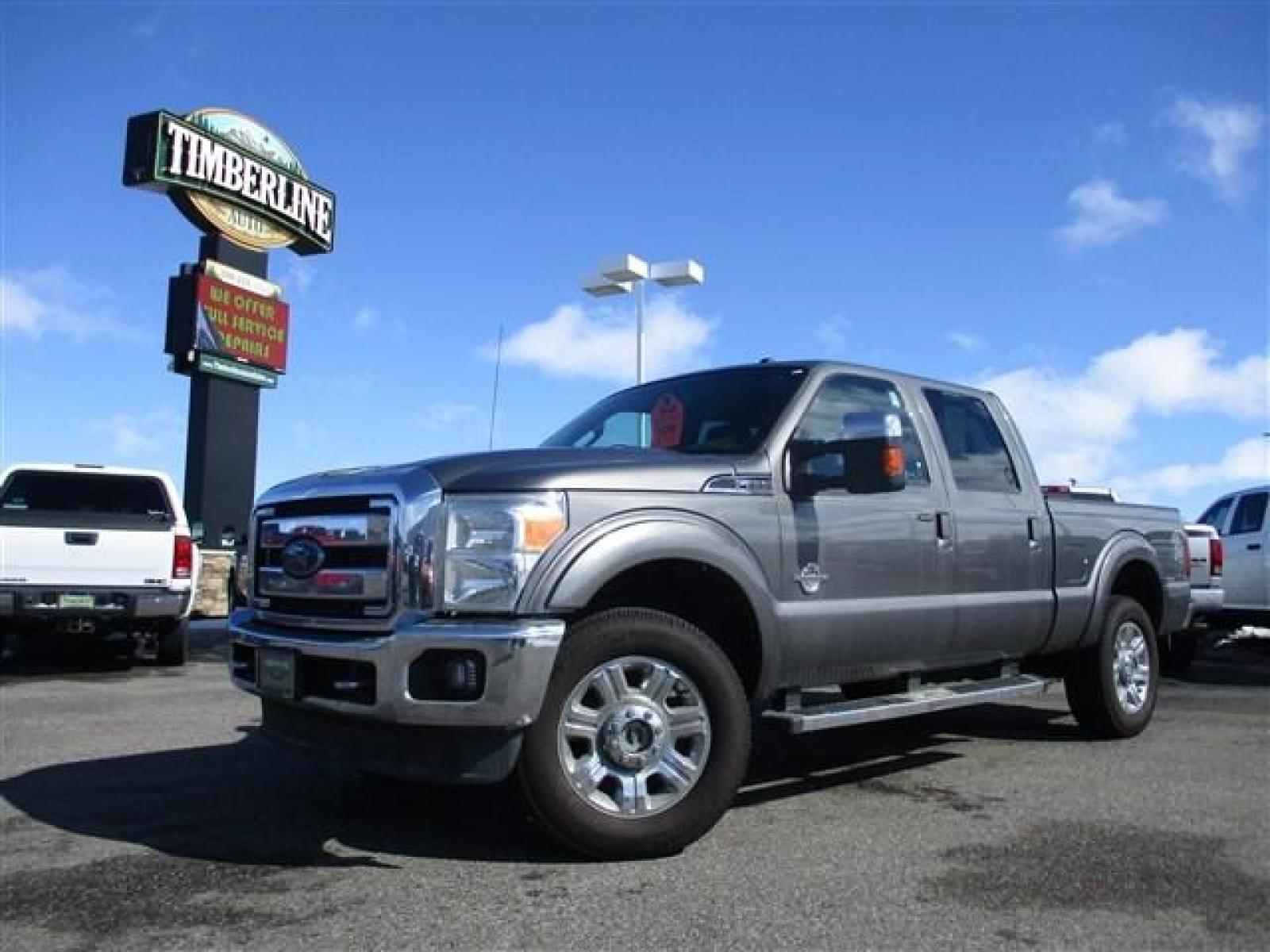 2012 GRAY /BLACK FORD F350 LARIAT (1FT8W3BT1CE) with an 8 engine, Automatic transmission, located at 1580 E Lincoln Rd, Idaho Falls, ID, 83401, (208) 523-4000, 0.000000, 0.000000 - SUPER CLEAN BODY AND PAINT. INTERIOR HAS NO TEARS OR ANYTHING MISSING. MECHANICALLY STOCK. STOCK SUSPENSION. FACTORY RUNNING BOARDS. FIFTH WHEEL RAILS AND REESE HITCH INSTALLED/INCLUDED. TIRES AT 80% TREAD. DUAL POWER SEATS. HEATED AND COOLED SEATS. SUNROOF. TRAILER BRAKE. EXHAUST BRAKE. LOCKING REA - Photo #0