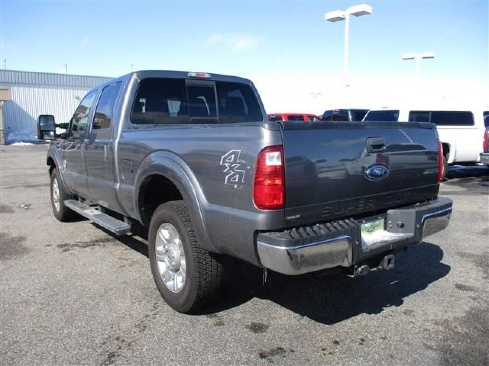 2012 GRAY /BLACK FORD F350 LARIAT (1FT8W3BT1CE) with an 8 engine, Automatic transmission, located at 1580 E Lincoln Rd, Idaho Falls, ID, 83401, (208) 523-4000, 0.000000, 0.000000 - SUPER CLEAN BODY AND PAINT. INTERIOR HAS NO TEARS OR ANYTHING MISSING. MECHANICALLY STOCK. STOCK SUSPENSION. FACTORY RUNNING BOARDS. FIFTH WHEEL RAILS AND REESE HITCH INSTALLED/INCLUDED. TIRES AT 80% TREAD. DUAL POWER SEATS. HEATED AND COOLED SEATS. SUNROOF. TRAILER BRAKE. EXHAUST BRAKE. LOCKING REA - Photo #3