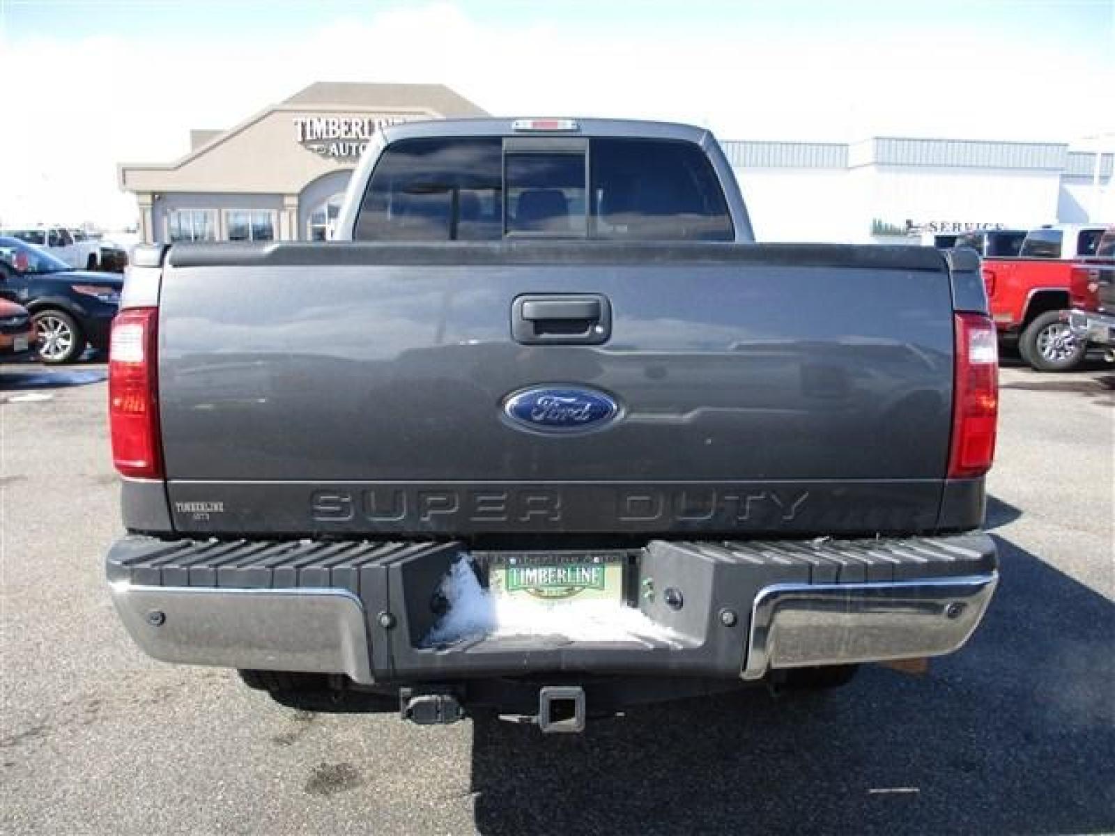 2012 GRAY /BLACK FORD F350 LARIAT (1FT8W3BT1CE) with an 8 engine, Automatic transmission, located at 1580 E Lincoln Rd, Idaho Falls, ID, 83401, (208) 523-4000, 0.000000, 0.000000 - SUPER CLEAN BODY AND PAINT. INTERIOR HAS NO TEARS OR ANYTHING MISSING. MECHANICALLY STOCK. STOCK SUSPENSION. FACTORY RUNNING BOARDS. FIFTH WHEEL RAILS AND REESE HITCH INSTALLED/INCLUDED. TIRES AT 80% TREAD. DUAL POWER SEATS. HEATED AND COOLED SEATS. SUNROOF. TRAILER BRAKE. EXHAUST BRAKE. LOCKING REA - Photo #4