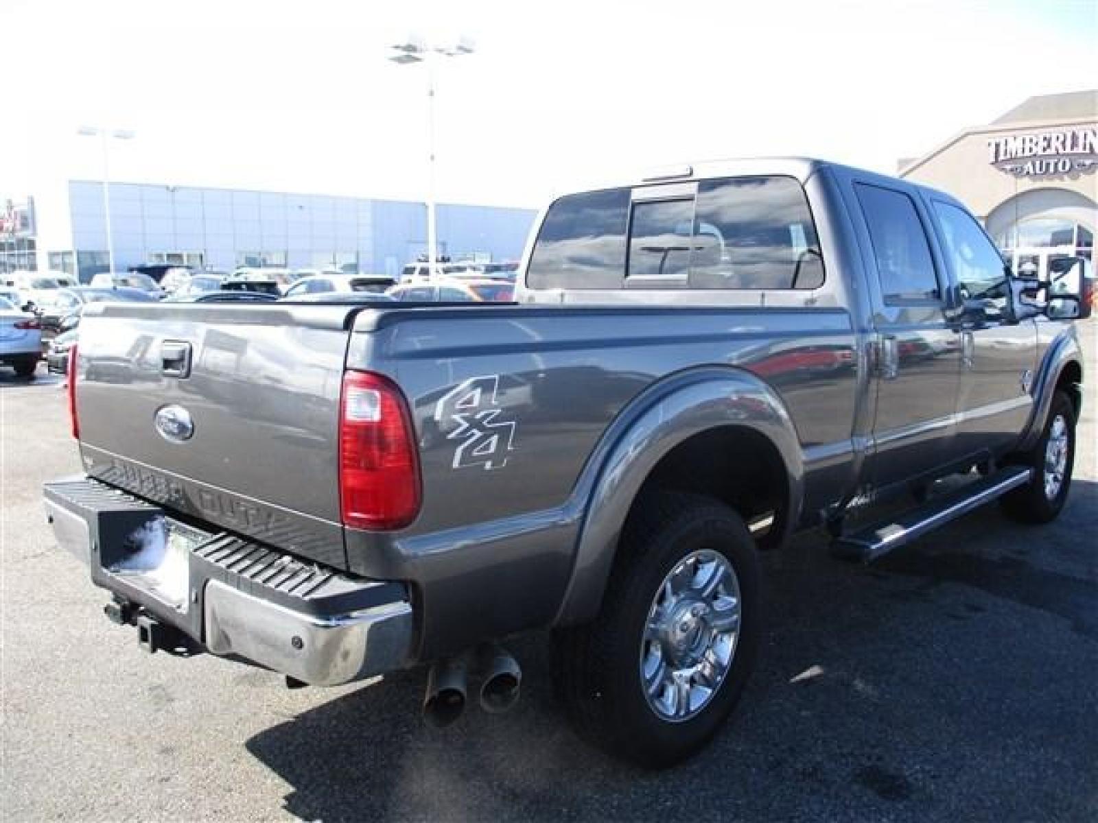 2012 GRAY /BLACK FORD F350 LARIAT (1FT8W3BT1CE) with an 8 engine, Automatic transmission, located at 1580 E Lincoln Rd, Idaho Falls, ID, 83401, (208) 523-4000, 0.000000, 0.000000 - SUPER CLEAN BODY AND PAINT. INTERIOR HAS NO TEARS OR ANYTHING MISSING. MECHANICALLY STOCK. STOCK SUSPENSION. FACTORY RUNNING BOARDS. FIFTH WHEEL RAILS AND REESE HITCH INSTALLED/INCLUDED. TIRES AT 80% TREAD. DUAL POWER SEATS. HEATED AND COOLED SEATS. SUNROOF. TRAILER BRAKE. EXHAUST BRAKE. LOCKING REA - Photo #5
