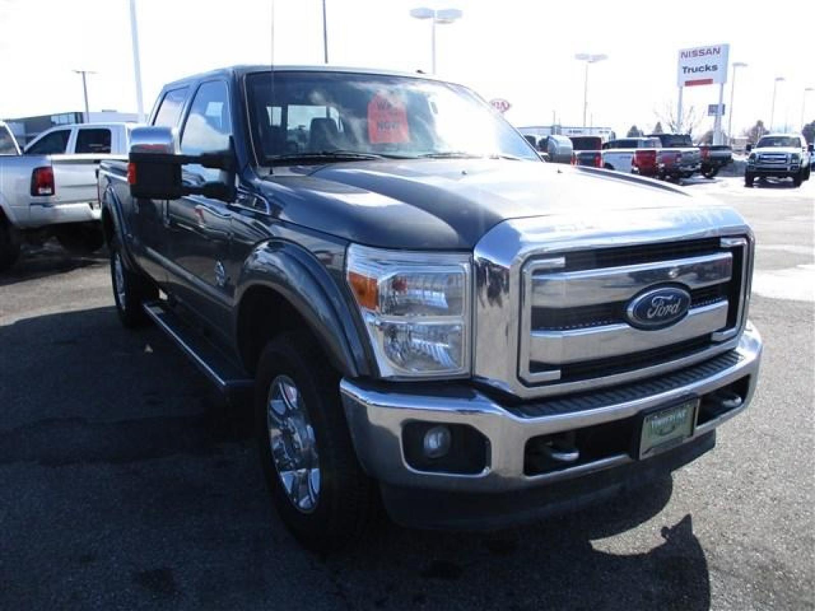 2012 GRAY /BLACK FORD F350 LARIAT (1FT8W3BT1CE) with an 8 engine, Automatic transmission, located at 1580 E Lincoln Rd, Idaho Falls, ID, 83401, (208) 523-4000, 0.000000, 0.000000 - SUPER CLEAN BODY AND PAINT. INTERIOR HAS NO TEARS OR ANYTHING MISSING. MECHANICALLY STOCK. STOCK SUSPENSION. FACTORY RUNNING BOARDS. FIFTH WHEEL RAILS AND REESE HITCH INSTALLED/INCLUDED. TIRES AT 80% TREAD. DUAL POWER SEATS. HEATED AND COOLED SEATS. SUNROOF. TRAILER BRAKE. EXHAUST BRAKE. LOCKING REA - Photo #7