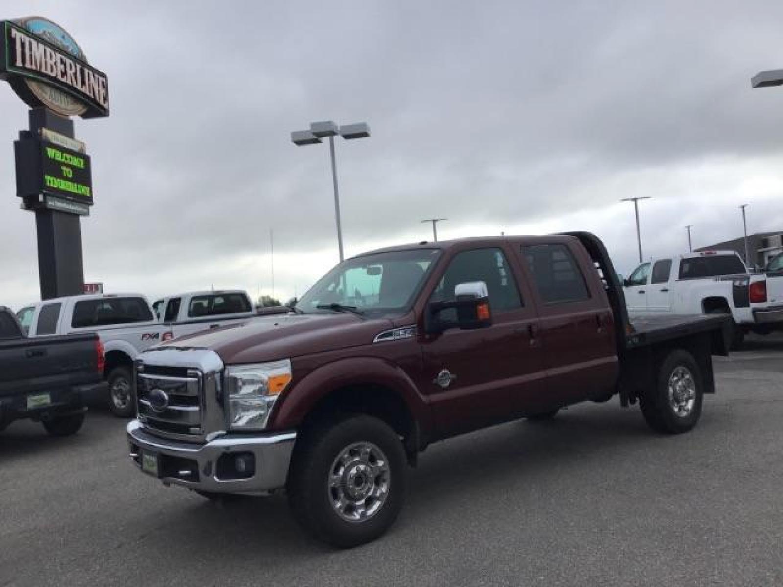 2012 MAROON /Black Leather Interior Ford F-350 SD Lariat Crew Cab 4WD (1FT8W3BTXCE) with an 6.7L V8 OHV 16V DIESEL engine, 6-Speed Automatic transmission, located at 1235 N Woodruff Ave., Idaho Falls, 83401, (208) 523-1053, 43.507172, -112.000488 - Photo #0