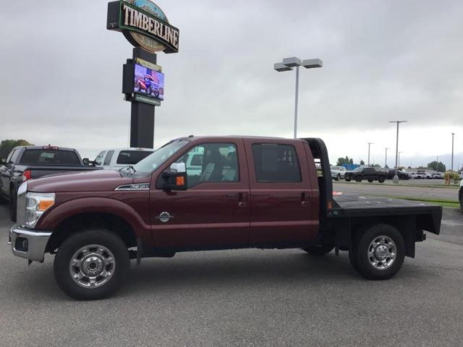 2012 MAROON /Black Leather Interior Ford F-350 SD Lariat Crew Cab 4WD (1FT8W3BTXCE) with an 6.7L V8 OHV 16V DIESEL engine, 6-Speed Automatic transmission, located at 1235 N Woodruff Ave., Idaho Falls, 83401, (208) 523-1053, 43.507172, -112.000488 - Photo #1