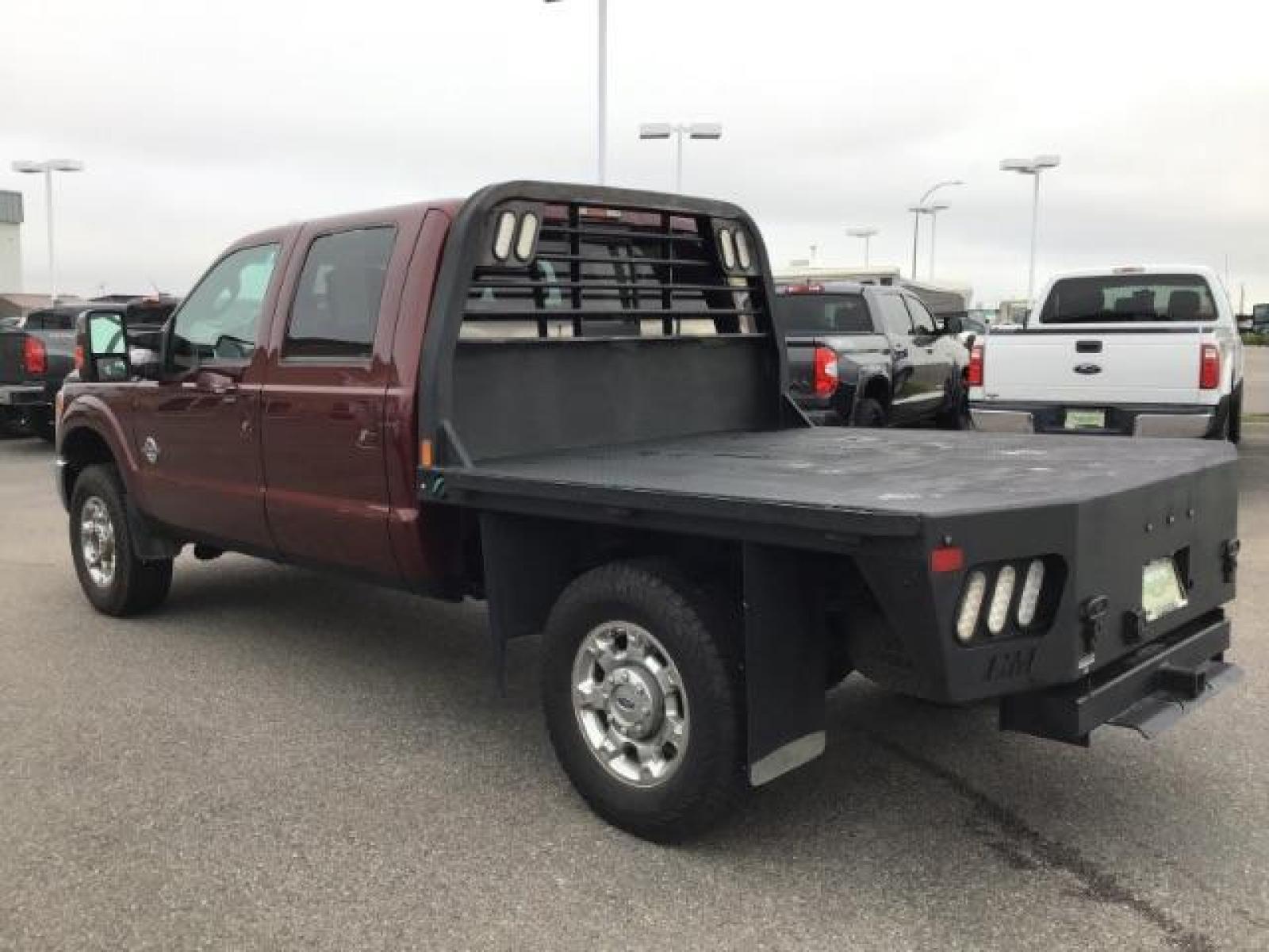 2012 MAROON /Black Leather Interior Ford F-350 SD Lariat Crew Cab 4WD (1FT8W3BTXCE) with an 6.7L V8 OHV 16V DIESEL engine, 6-Speed Automatic transmission, located at 1235 N Woodruff Ave., Idaho Falls, 83401, (208) 523-1053, 43.507172, -112.000488 - Photo #2