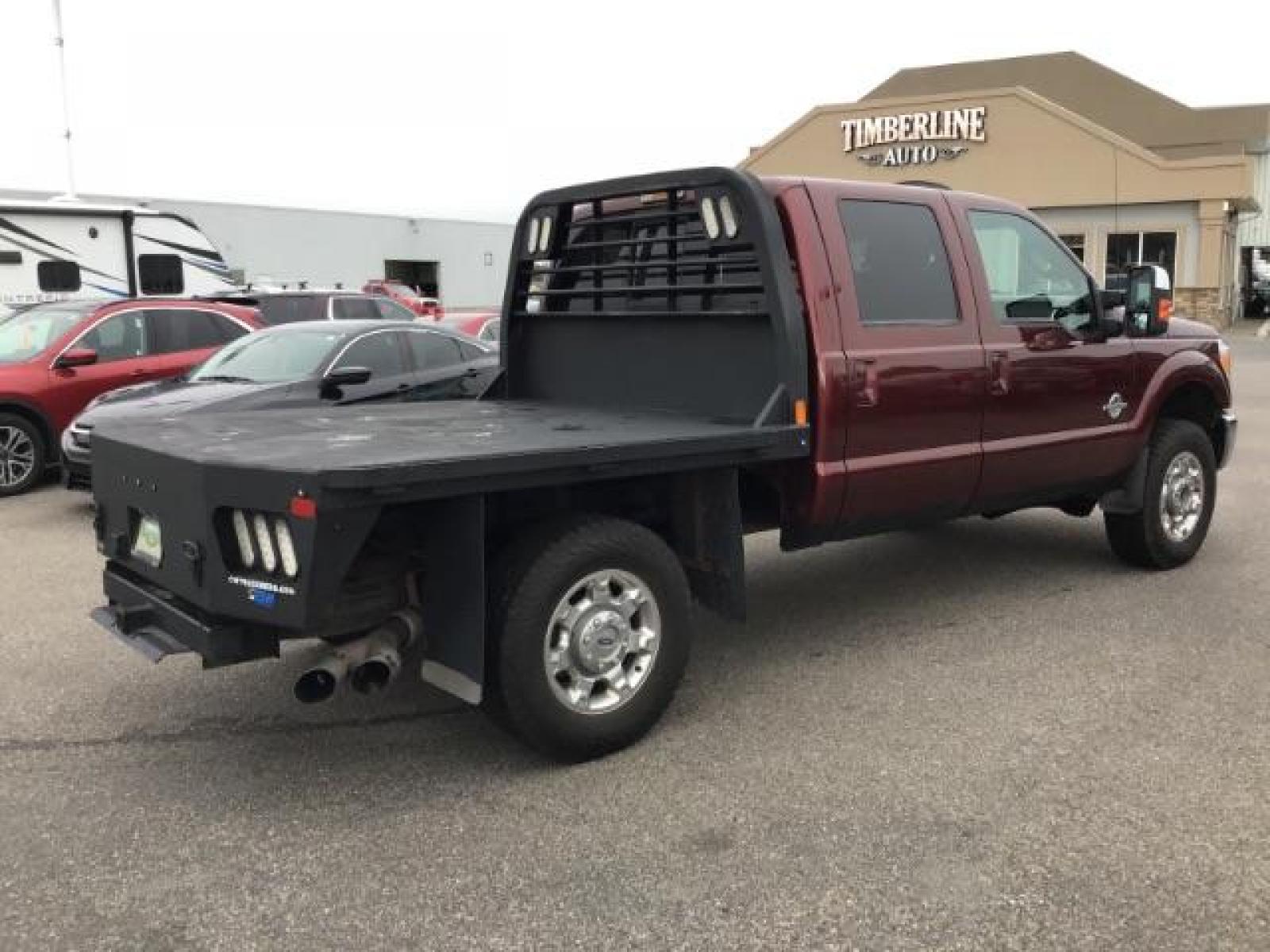 2012 MAROON /Black Leather Interior Ford F-350 SD Lariat Crew Cab 4WD (1FT8W3BTXCE) with an 6.7L V8 OHV 16V DIESEL engine, 6-Speed Automatic transmission, located at 1235 N Woodruff Ave., Idaho Falls, 83401, (208) 523-1053, 43.507172, -112.000488 - Photo #4