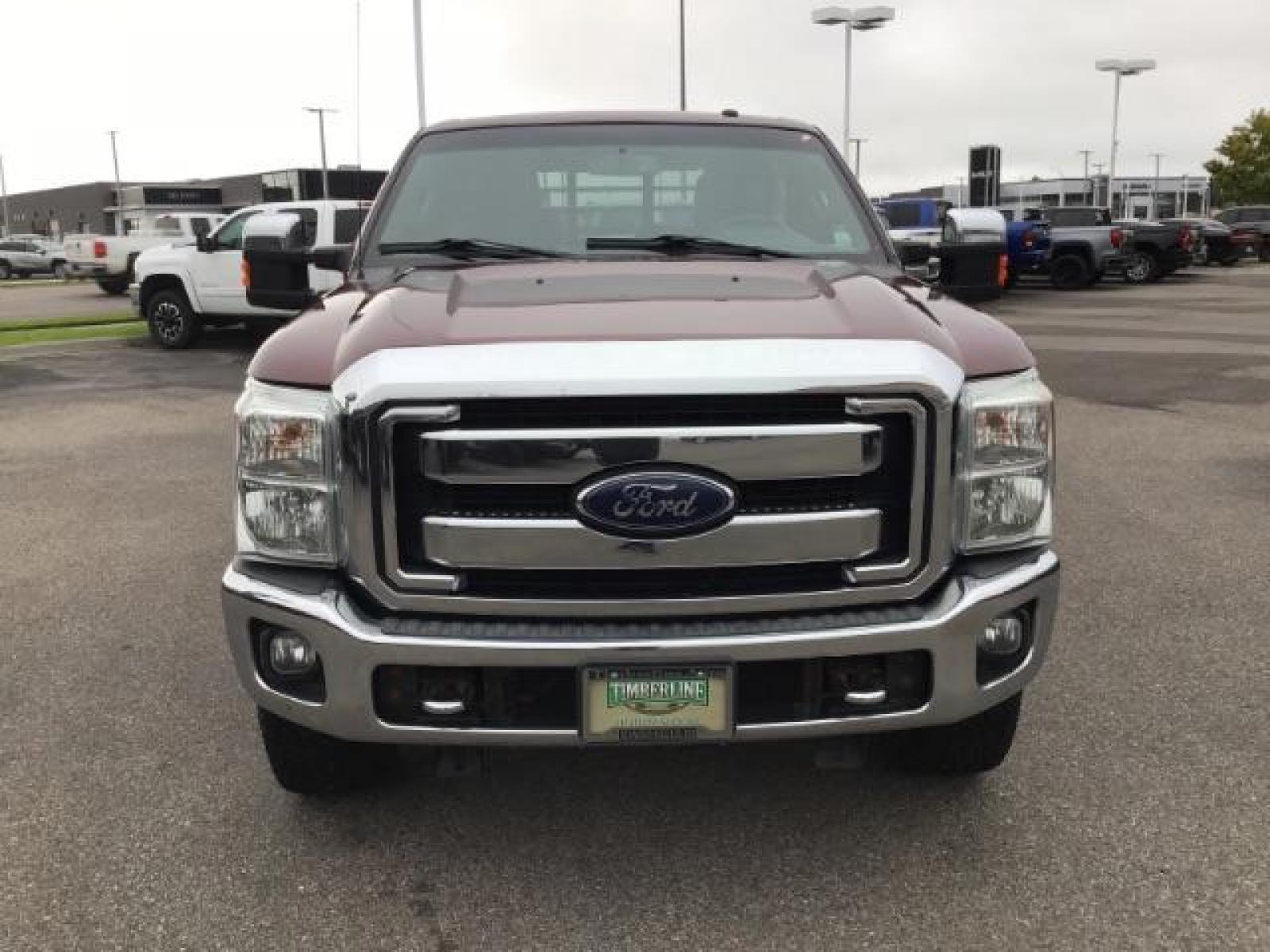 2012 MAROON /Black Leather Interior Ford F-350 SD Lariat Crew Cab 4WD (1FT8W3BTXCE) with an 6.7L V8 OHV 16V DIESEL engine, 6-Speed Automatic transmission, located at 1235 N Woodruff Ave., Idaho Falls, 83401, (208) 523-1053, 43.507172, -112.000488 - Photo #7