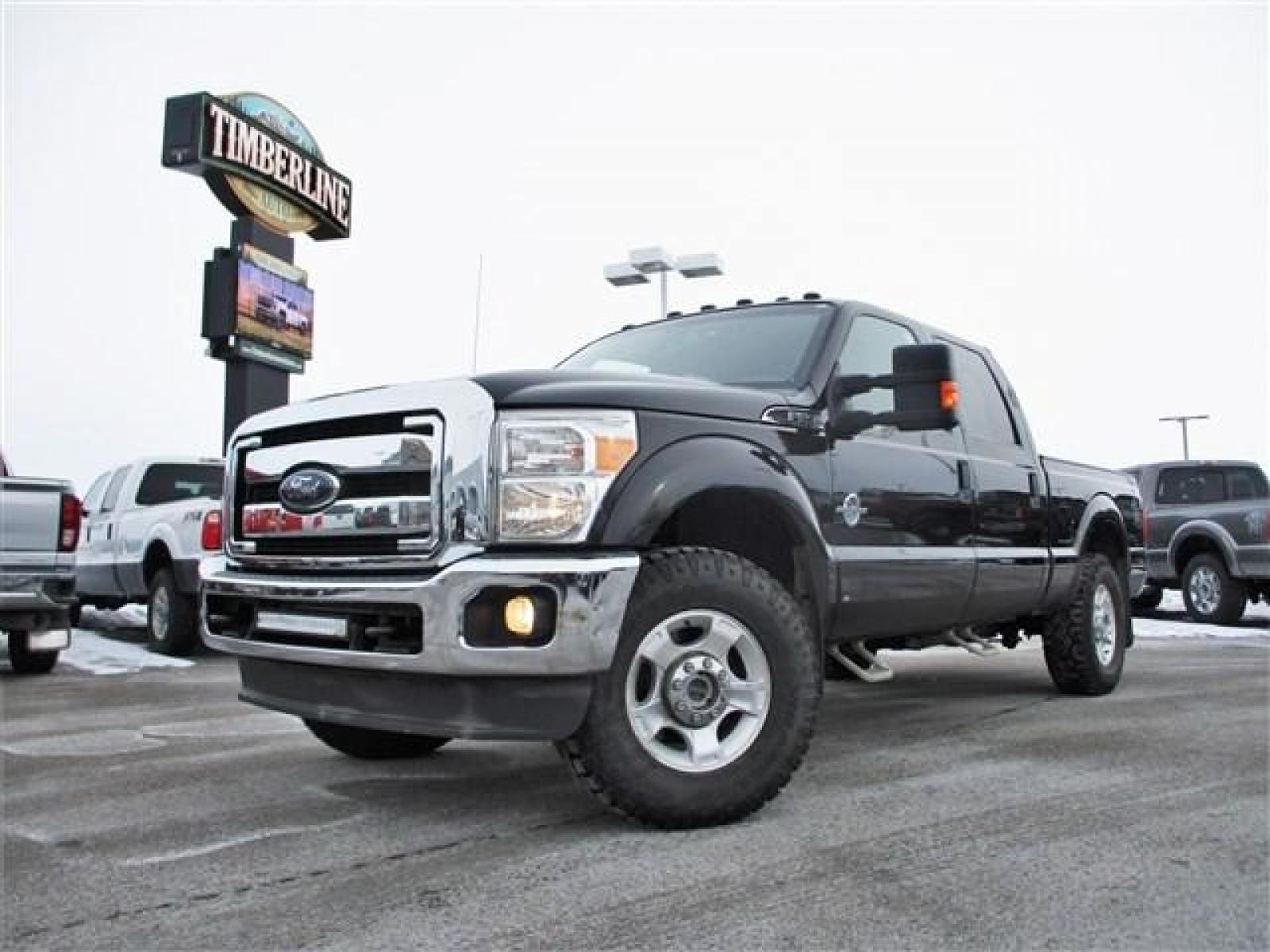 2014 BLACK /BLACK FORD F250 XLT (1FT7W2BT8EE) with an 8 engine, Automatic transmission, located at 1580 E Lincoln Rd, Idaho Falls, ID, 83401, (208) 523-4000, 0.000000, 0.000000 - This 2014 Ford F250 XLT has had some amazing improvements! To start all the cloth seats have been replaced with Lariat leather, the seats have been converted to heated and cooled using OEM parts and controls, a center console was added, an OEM backup camera was installed using the rear view mirror s - Photo #0