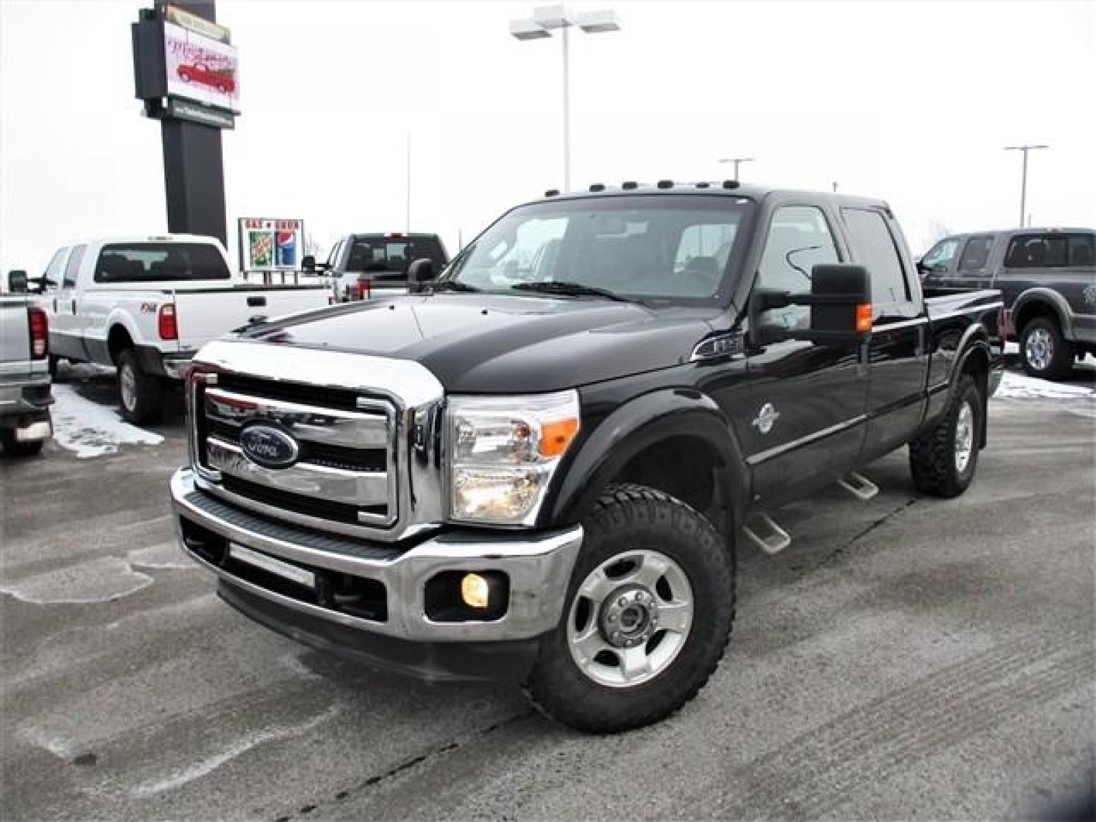 2014 BLACK /BLACK FORD F250 XLT (1FT7W2BT8EE) with an 8 engine, Automatic transmission, located at 1580 E Lincoln Rd, Idaho Falls, ID, 83401, (208) 523-4000, 0.000000, 0.000000 - This 2014 Ford F250 XLT has had some amazing improvements! To start all the cloth seats have been replaced with Lariat leather, the seats have been converted to heated and cooled using OEM parts and controls, a center console was added, an OEM backup camera was installed using the rear view mirror s - Photo #1