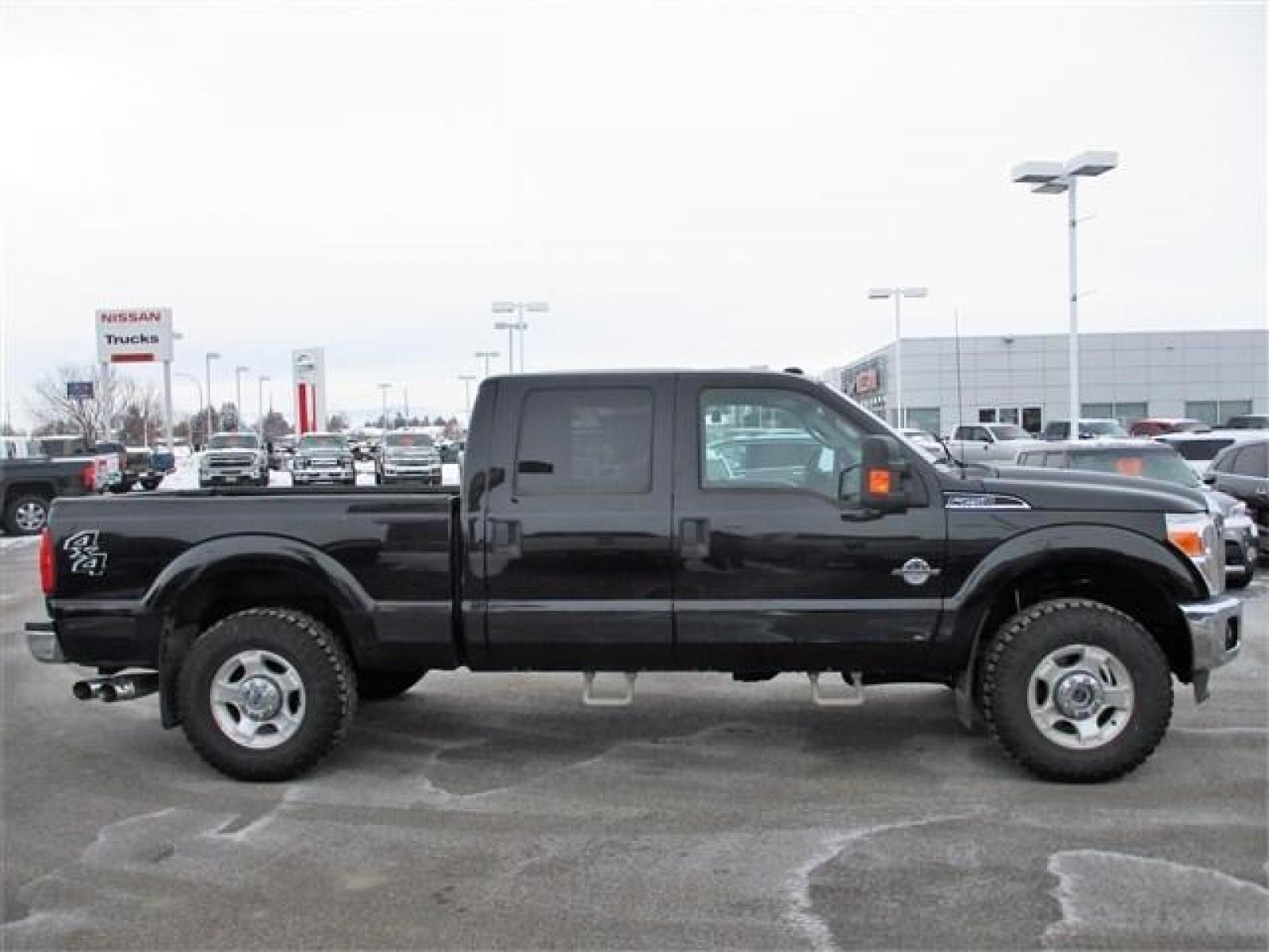 2014 BLACK /BLACK FORD F250 XLT (1FT7W2BT8EE) with an 8 engine, Automatic transmission, located at 1580 E Lincoln Rd, Idaho Falls, ID, 83401, (208) 523-4000, 0.000000, 0.000000 - This 2014 Ford F250 XLT has had some amazing improvements! To start all the cloth seats have been replaced with Lariat leather, the seats have been converted to heated and cooled using OEM parts and controls, a center console was added, an OEM backup camera was installed using the rear view mirror s - Photo #6