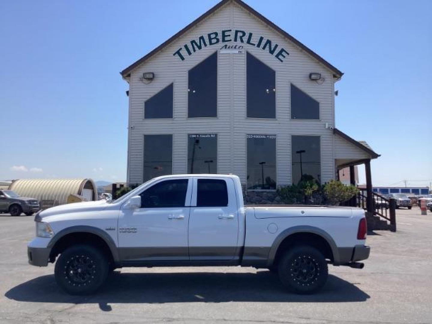2013 WHITE RAM 1500 SLT Quad Cab 4WD (1C6RR7GTXDS) with an 5.7L V8 OHV 16V engine, 6-Speed Automatic transmission, located at 1235 N Woodruff Ave., Idaho Falls, 83401, (208) 523-1053, 43.507172, -112.000488 - Photo#2