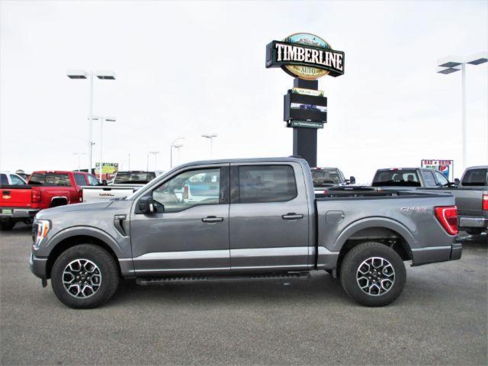 2022 Carbonized Gray Metallic /Black/Medium Dark Slate Ford F-150 Sport SuperCrew 5.5-ft. Bed 4WD (1FTFW1E86NK) with an 3.5L V6 DOHC 24V engine, 10-Speed Automatic transmission, located at 1235 N Woodruff Ave., Idaho Falls, 83401, (208) 523-1053, 43.507172, -112.000488 - Outside you see the factory sport wheels, wide running boards, and color matched bumpers. Inside you see an inviting cloth grey interior with dual power seats, heated seats, a large 12 inch touchscreen display offering a high definition back up camera, blind spot monitors, lane assist, remote start, - Photo #2