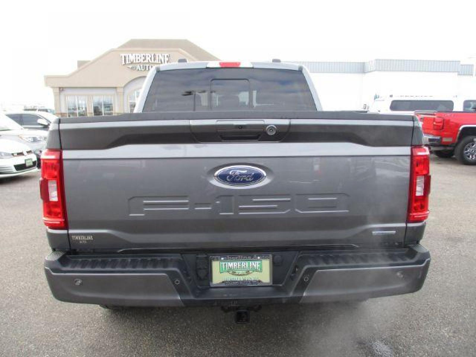 2022 Carbonized Gray Metallic /Black/Medium Dark Slate Ford F-150 Sport SuperCrew 5.5-ft. Bed 4WD (1FTFW1E86NK) with an 3.5L V6 DOHC 24V engine, 10-Speed Automatic transmission, located at 1235 N Woodruff Ave., Idaho Falls, 83401, (208) 523-1053, 43.507172, -112.000488 - Outside you see the factory sport wheels, wide running boards, and color matched bumpers. Inside you see an inviting cloth grey interior with dual power seats, heated seats, a large 12 inch touchscreen display offering a high definition back up camera, blind spot monitors, lane assist, remote start, - Photo #4