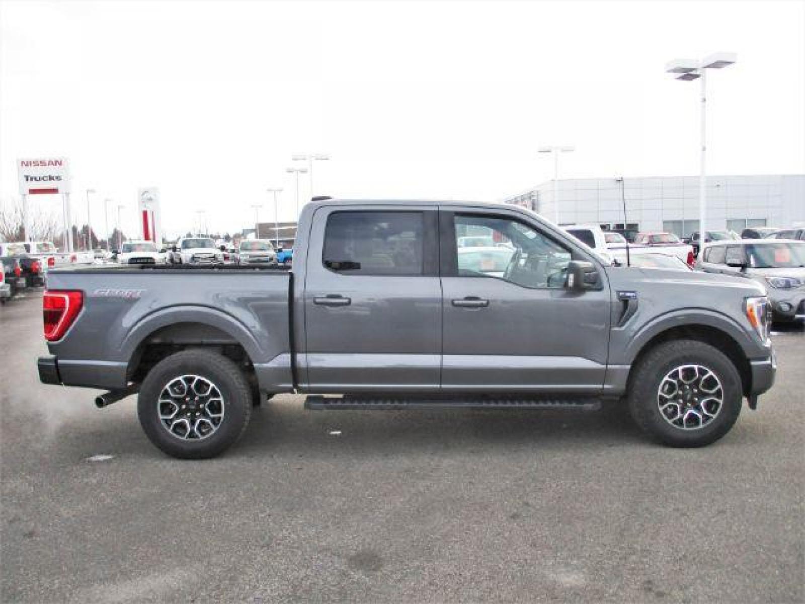 2022 Carbonized Gray Metallic /Black/Medium Dark Slate Ford F-150 Sport SuperCrew 5.5-ft. Bed 4WD (1FTFW1E86NK) with an 3.5L V6 DOHC 24V engine, 10-Speed Automatic transmission, located at 1235 N Woodruff Ave., Idaho Falls, 83401, (208) 523-1053, 43.507172, -112.000488 - Outside you see the factory sport wheels, wide running boards, and color matched bumpers. Inside you see an inviting cloth grey interior with dual power seats, heated seats, a large 12 inch touchscreen display offering a high definition back up camera, blind spot monitors, lane assist, remote start, - Photo #6