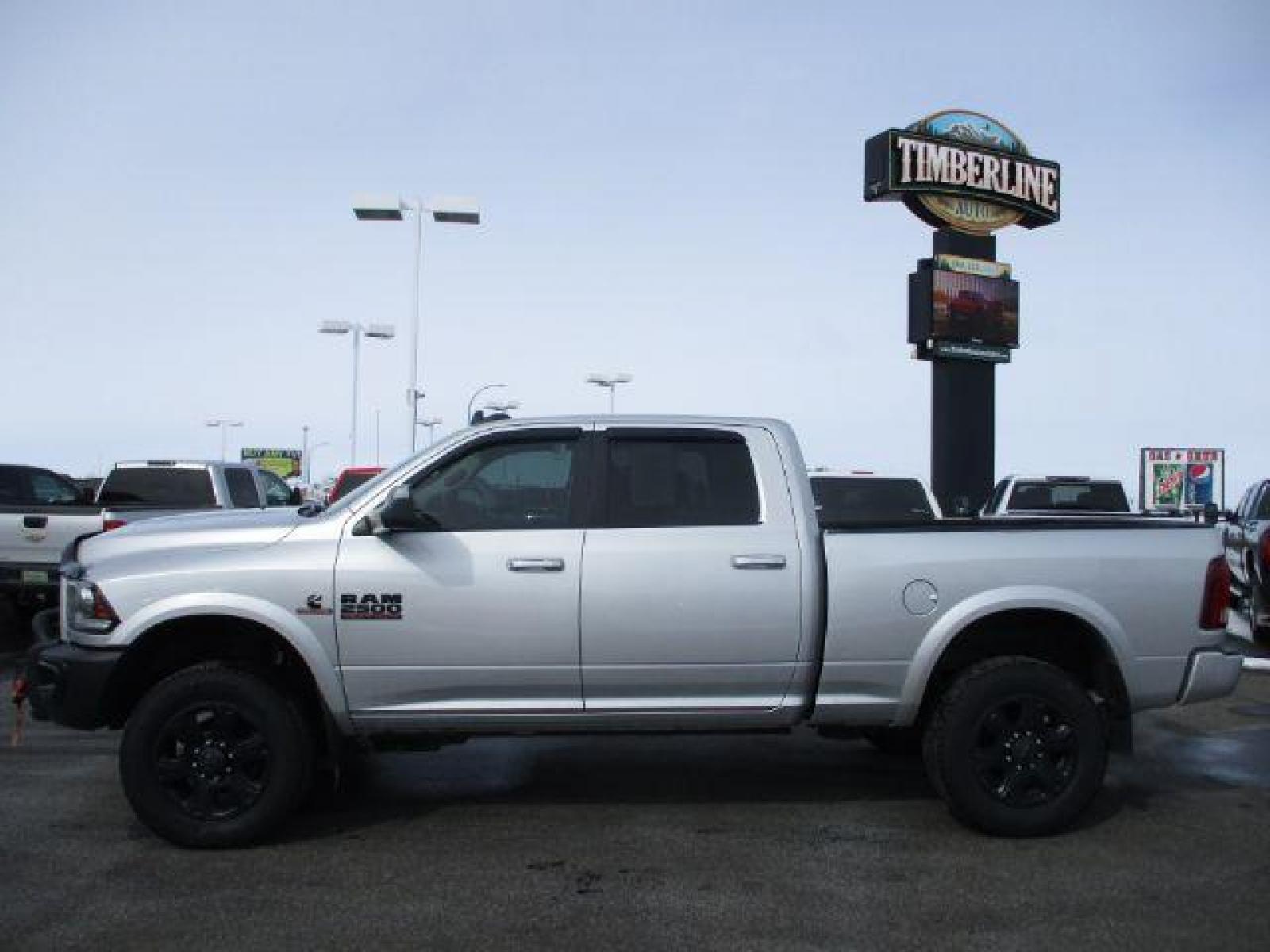 2017 Maximum Steel Metallic Clear Coat/Bright Silver Me /Black, leather RAM 2500 Laramie Crew Cab SWB 4WD (3C6UR5FL4HG) with an 6.7L L6 OHV 24V TURBO DIESEL engine, 6-Speed Automatic transmission, located at 1235 N Woodruff Ave., Idaho Falls, 83401, (208) 523-1053, 43.507172, -112.000488 - Here we have a 2017 RAM 2500 LARAMIE with the 6.7L straight six turbo diesel engine. The truck rides on coil springs in the front and in the rear offering a smoother ride than its older counterparts. With that suspension you'll notice a tighter turning radius and a wide range of drivability differen - Photo #2