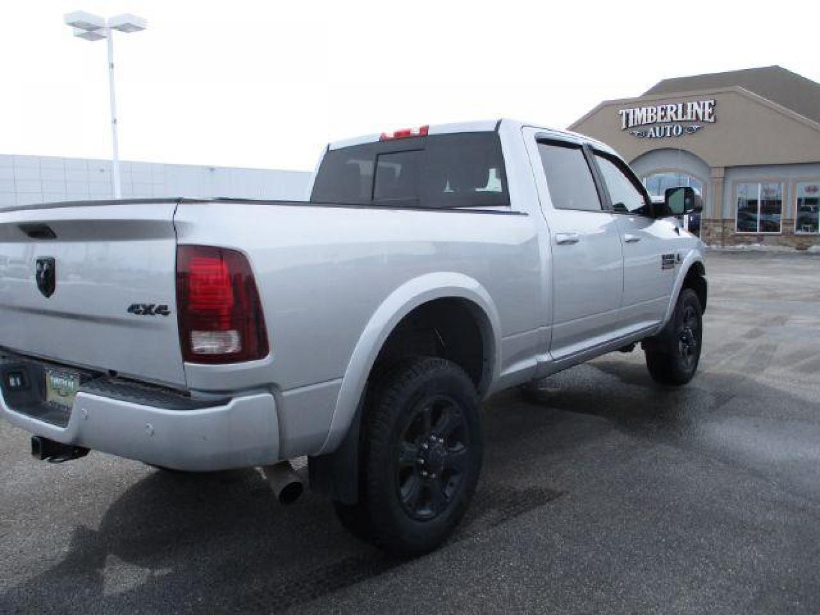 2017 Maximum Steel Metallic Clear Coat/Bright Silver Me /Black, leather RAM 2500 Laramie Crew Cab SWB 4WD (3C6UR5FL4HG) with an 6.7L L6 OHV 24V TURBO DIESEL engine, 6-Speed Automatic transmission, located at 1235 N Woodruff Ave., Idaho Falls, 83401, (208) 523-1053, 43.507172, -112.000488 - Here we have a 2017 RAM 2500 LARAMIE with the 6.7L straight six turbo diesel engine. The truck rides on coil springs in the front and in the rear offering a smoother ride than its older counterparts. With that suspension you'll notice a tighter turning radius and a wide range of drivability differen - Photo #5