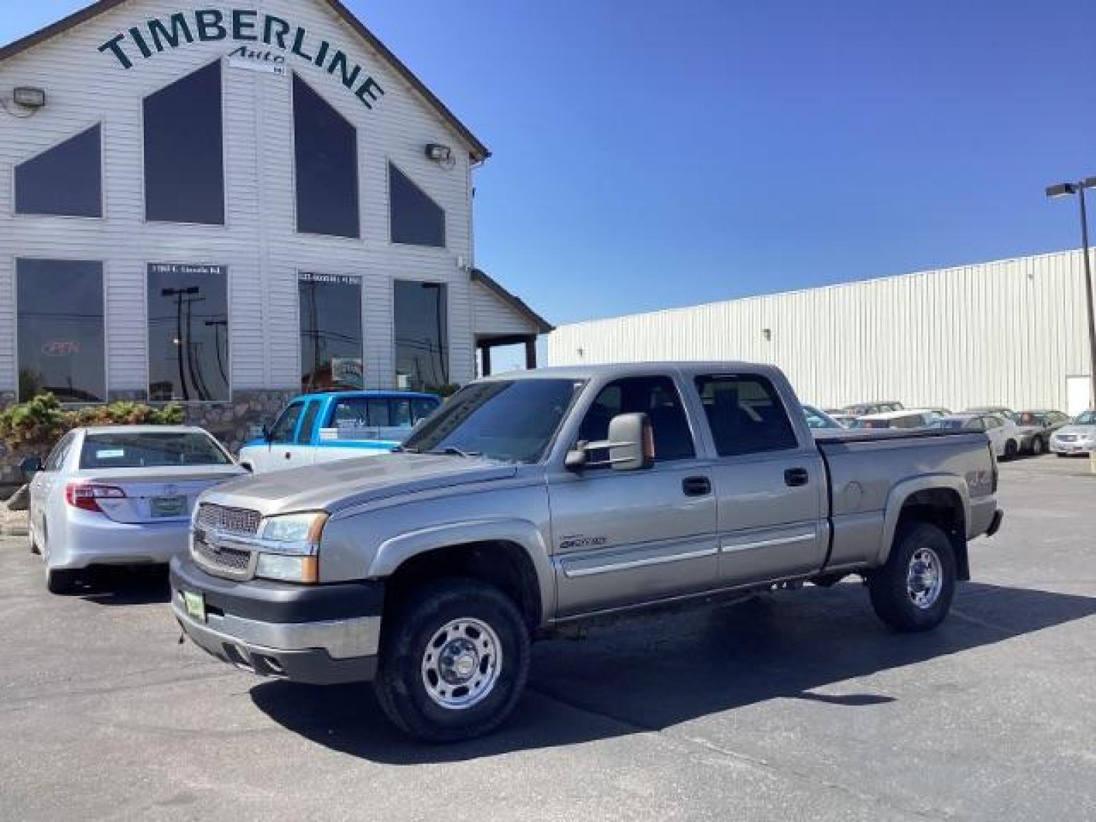 2003 Light Pewter Metallic /Dark Charcoal Cloth Interior Chevrolet Silverado 2500HD LS Crew Cab Short Bed 4WD (1GCHK23183F) with an 6.6L V8 OHV 32V TURBO DIESEL engine, 5-Speed Automatic transmission, located at 1235 N Woodruff Ave., Idaho Falls, 83401, (208) 523-1053, 43.507172, -112.000488 - The 2003 Chevrolet Silverado 2500 Duramax is a robust and capable heavy-duty truck, particularly renowned for its towing and hauling capabilities. Here are some of its key features: Engine: The standout feature of the 2003 Silverado 2500 Duramax is its 6.6-liter Duramax turbocharged diesel V8 engin - Photo #1