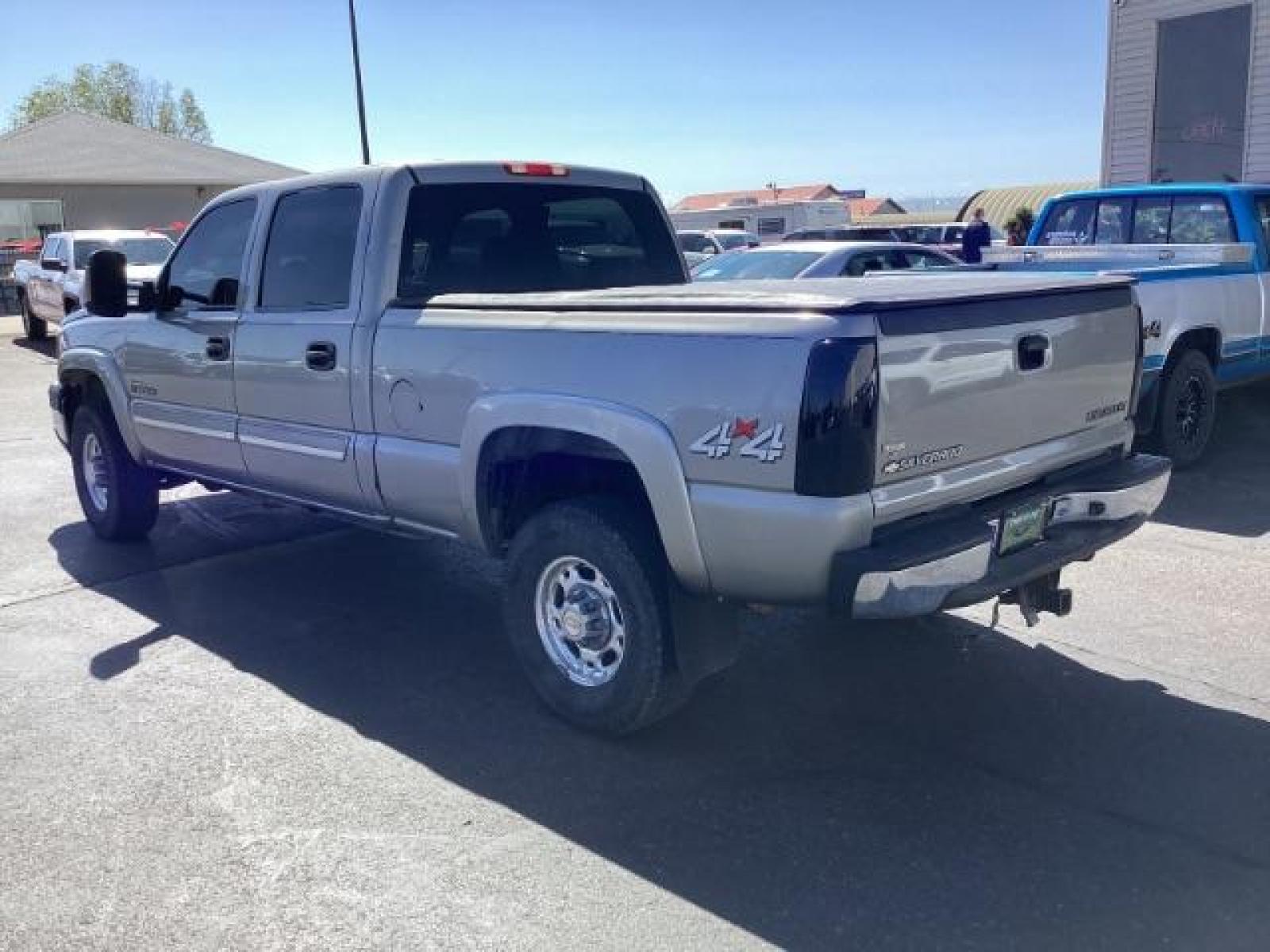 2003 Light Pewter Metallic /Dark Charcoal Cloth Interior Chevrolet Silverado 2500HD LS Crew Cab Short Bed 4WD (1GCHK23183F) with an 6.6L V8 OHV 32V TURBO DIESEL engine, 5-Speed Automatic transmission, located at 1235 N Woodruff Ave., Idaho Falls, 83401, (208) 523-1053, 43.507172, -112.000488 - The 2003 Chevrolet Silverado 2500 Duramax is a robust and capable heavy-duty truck, particularly renowned for its towing and hauling capabilities. Here are some of its key features: Engine: The standout feature of the 2003 Silverado 2500 Duramax is its 6.6-liter Duramax turbocharged diesel V8 engin - Photo #3