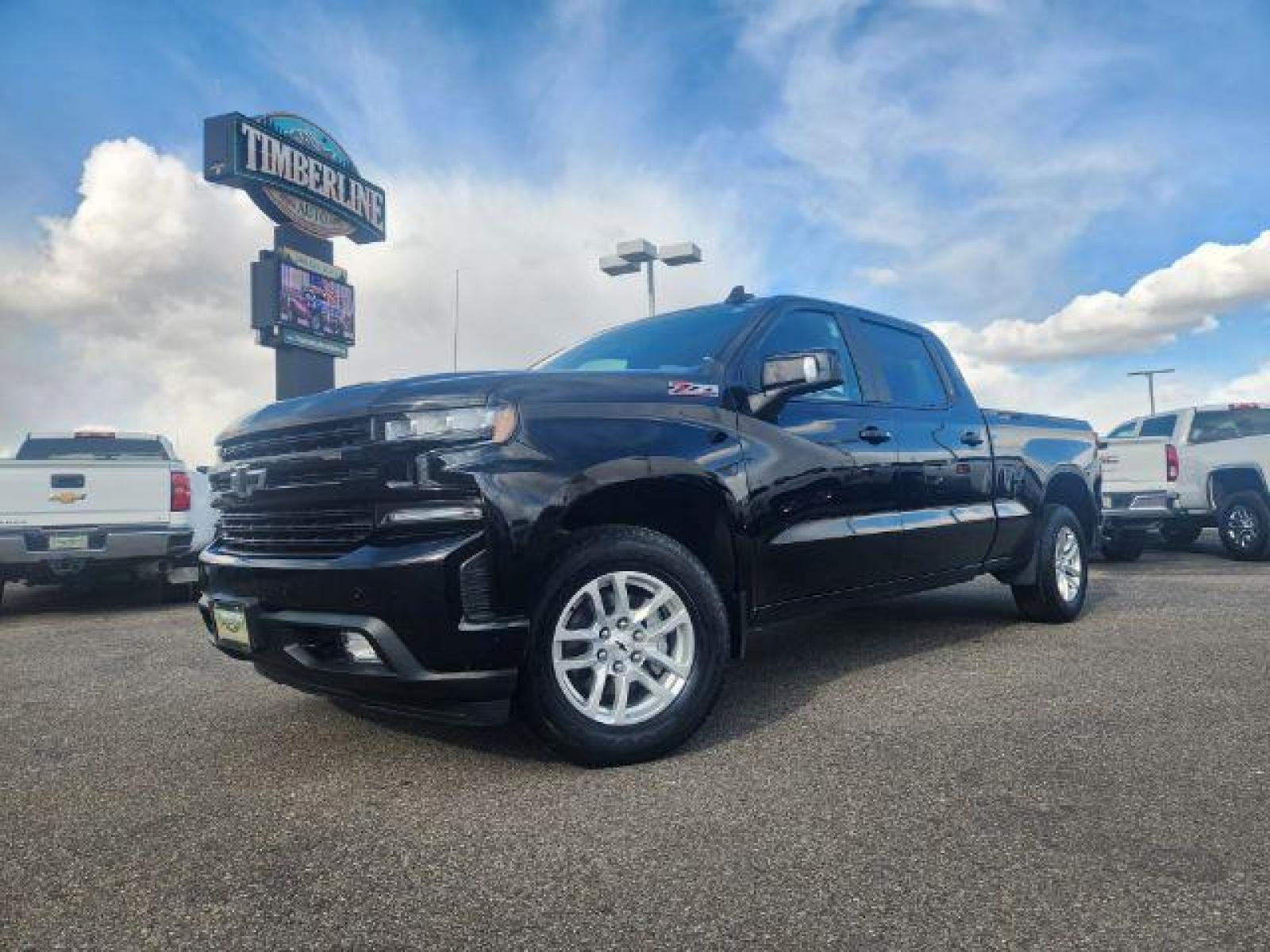 2020 Black /Jet Black, leather Chevrolet Silverado 1500 RST Crew Cab Long Box 4WD (1GCUYEEL3LZ) with an 6.2L V8 OHV 16V engine, Automatic transmission, located at 1235 N Woodruff Ave., Idaho Falls, 83401, (208) 523-1053, 43.507172, -112.000488 - These 6.2L V8 Chevy half tons with the crew cab and the 6.5ft bed are almost impossible to find! This truck is in amazing condition inside and out! It is completely stock with zero modifications. With such low miles this vehicle should last you a very long time! The black exterior is complimented by - Photo #0