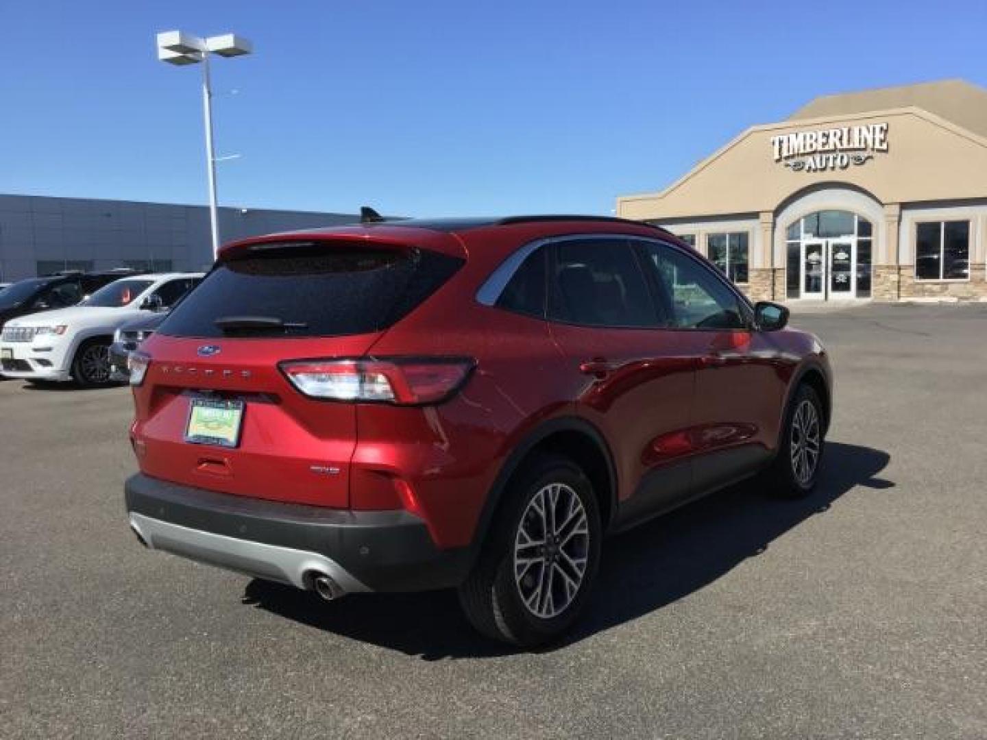 2021 Rapid Red Metallic Tinted Clearcoat /Ebony Ford Escape SEL AWD (1FMCU9H62MU) with an 1.5L L3 engine, 8-Speed Automatic transmission, located at 1235 N Woodruff Ave., Idaho Falls, 83401, (208) 523-1053, 43.507172, -112.000488 - 2021 Ford Escape SEL package with the 1.5L EcoBoost engine, heated seats, remote start, dual moonroof, and so much more! At Timberline Auto it is always easy to find a great deal on your next vehicle! Our experienced sales staff can help find the right vehicle that will fit your needs. Our knowled - Photo#5